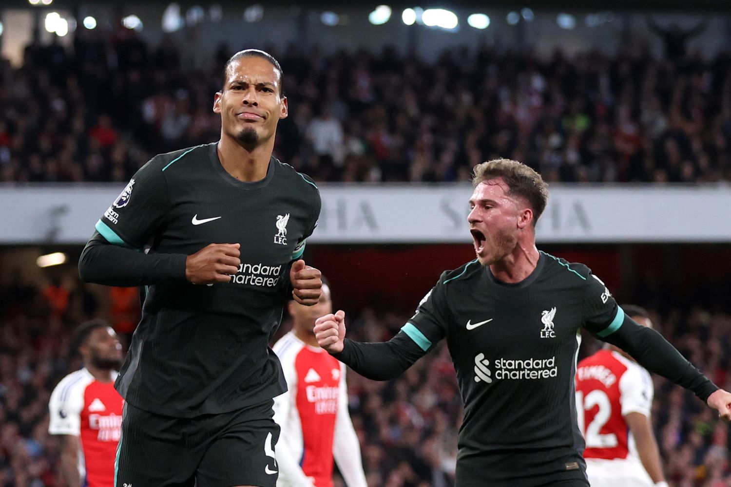 Virgil van Dijk celebrates scoring against Arsenal