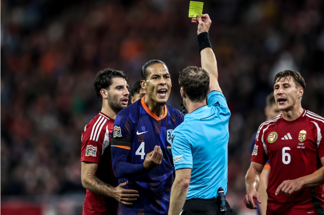 Virgil van Dijk is booked for dissent towards the referee