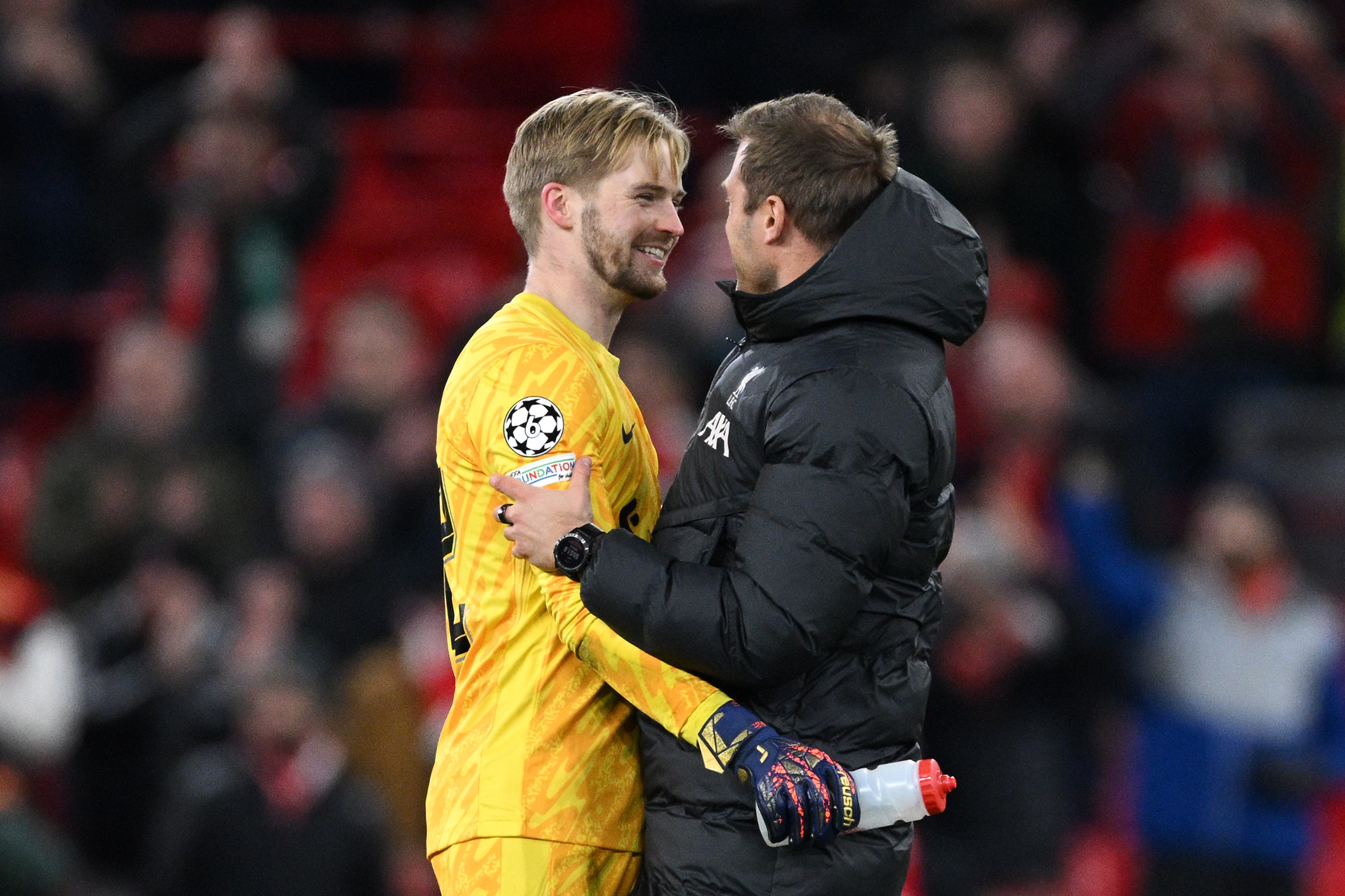 Caoimhin Kelleher interacts with Fabian Otte after beating Real Madrid at Anfield.