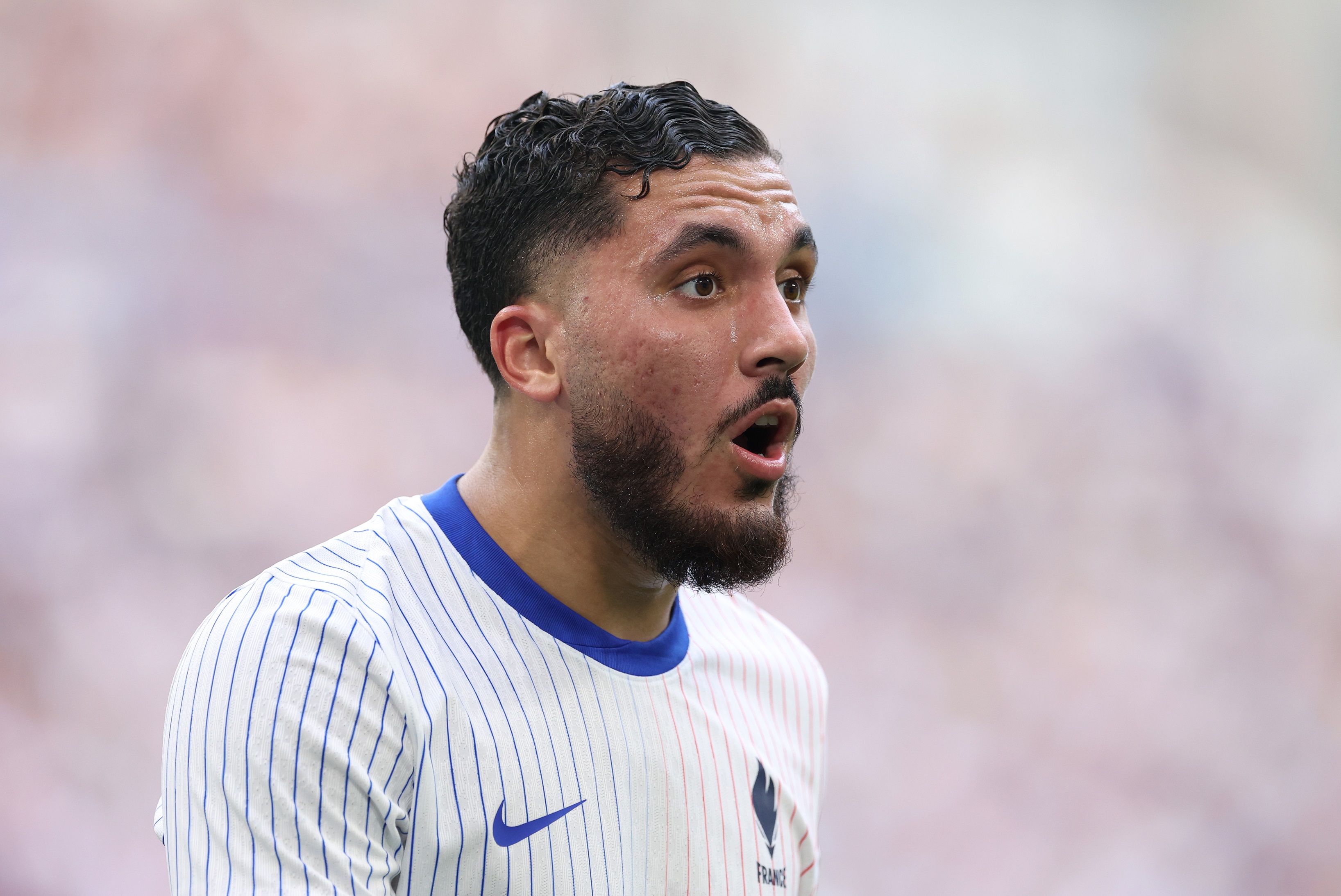 Rayan Cherki in action for France during the 2024 Olympics.