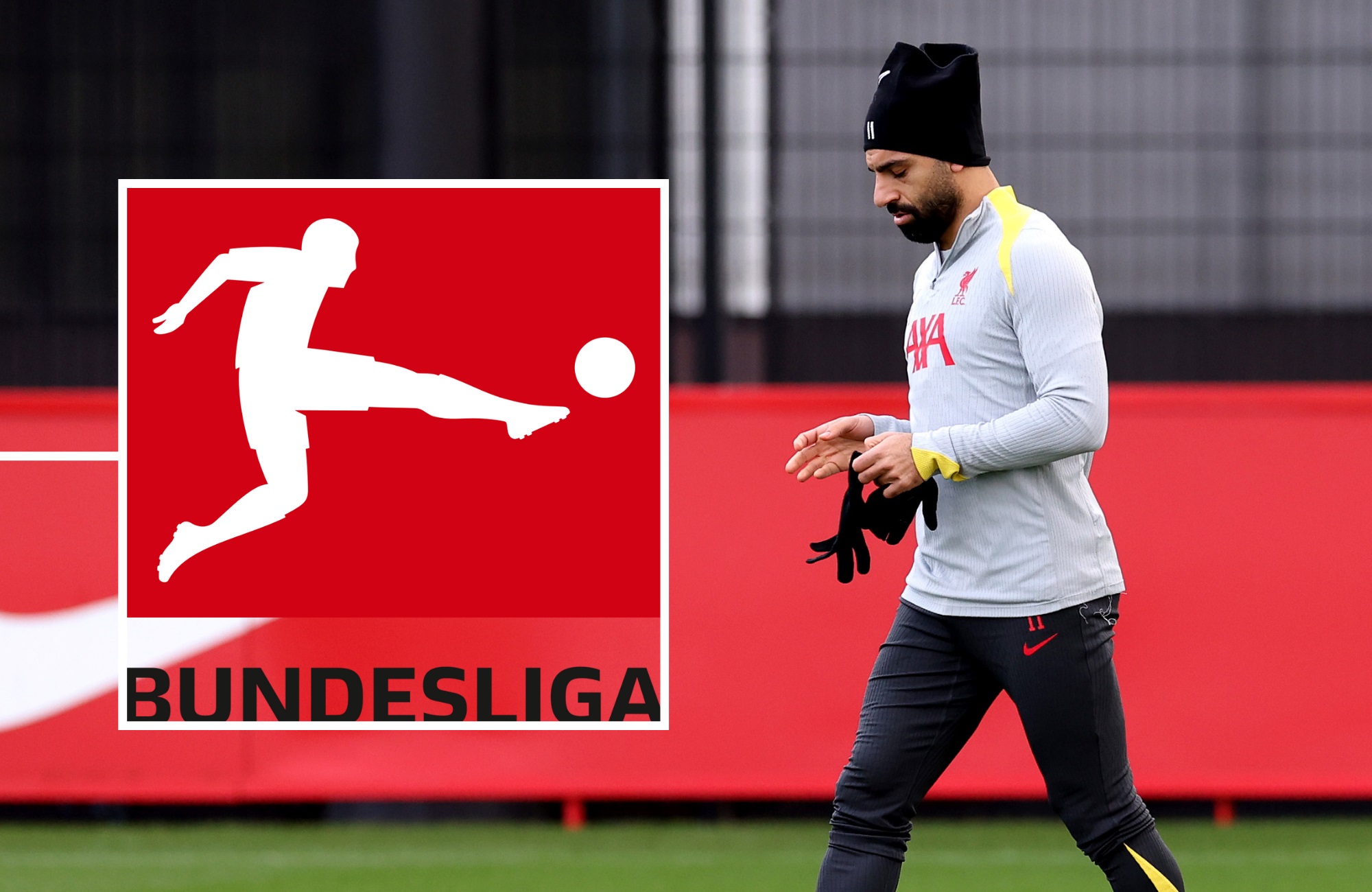 Mo Salah takes off his gloves during a Liverpool training session.
