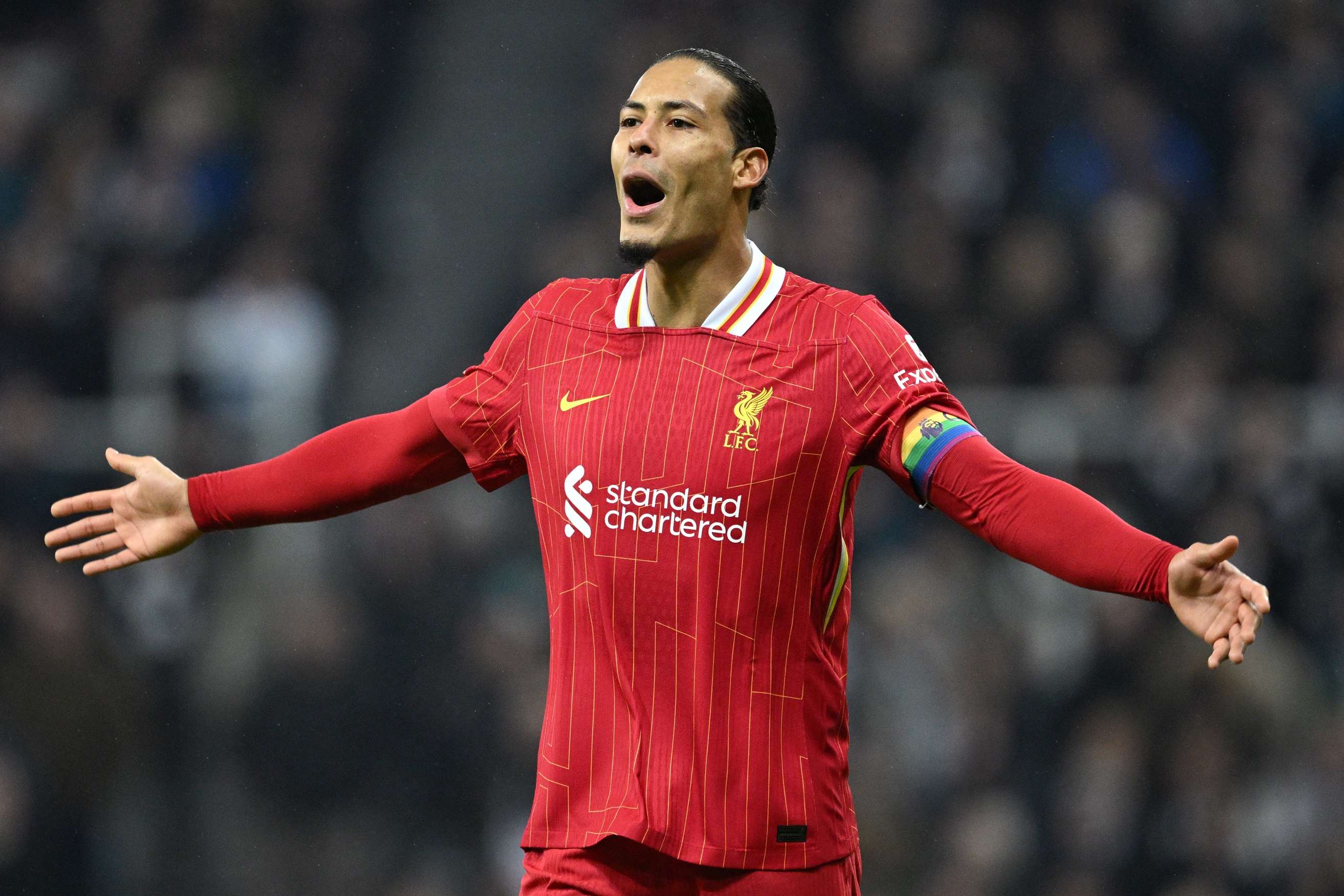 Virgil van Dijk speaks to his teammates during Liverpool v Newcastle.