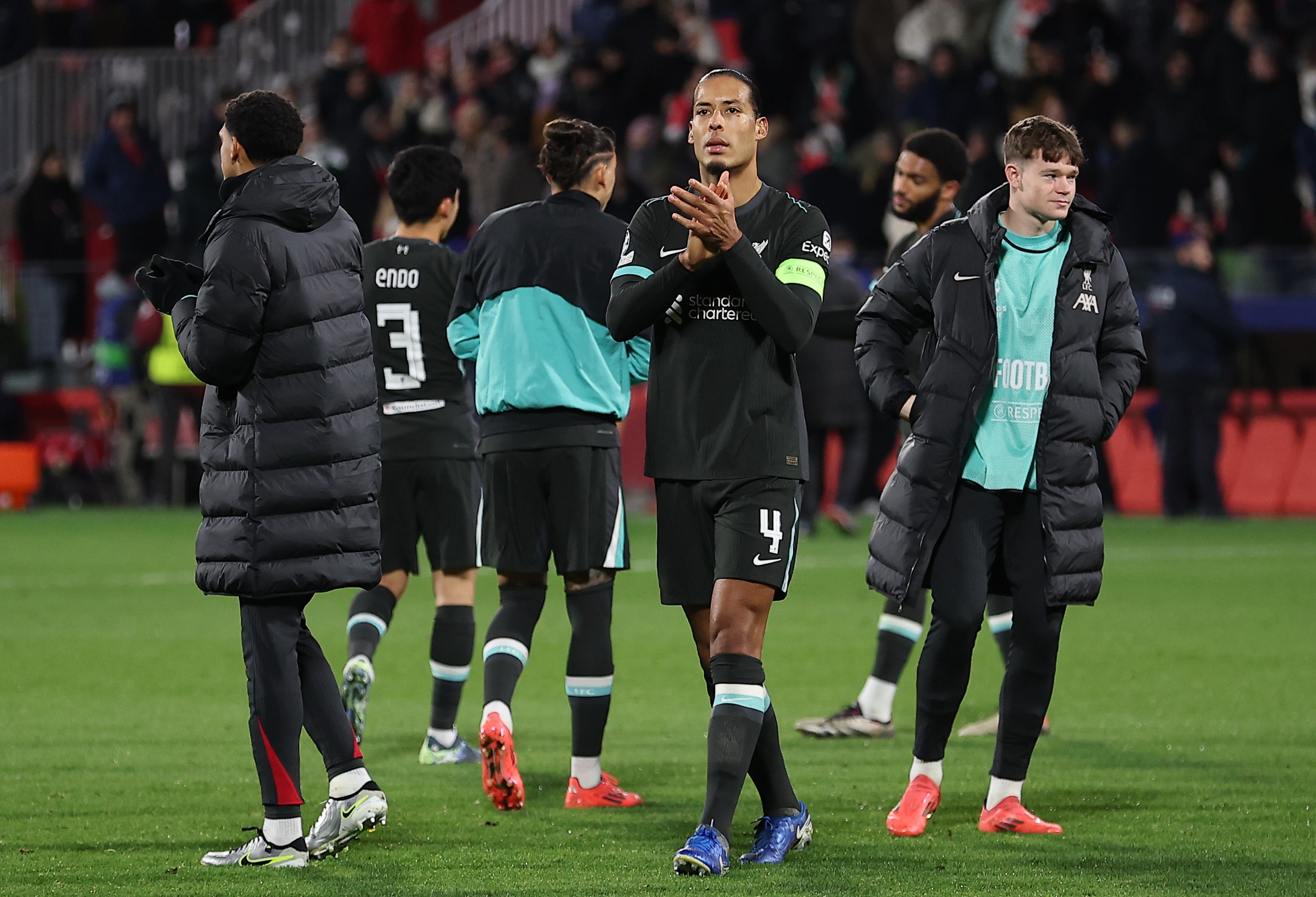 Virgil van Dijk applauds Liverpool fans after beating Girona.