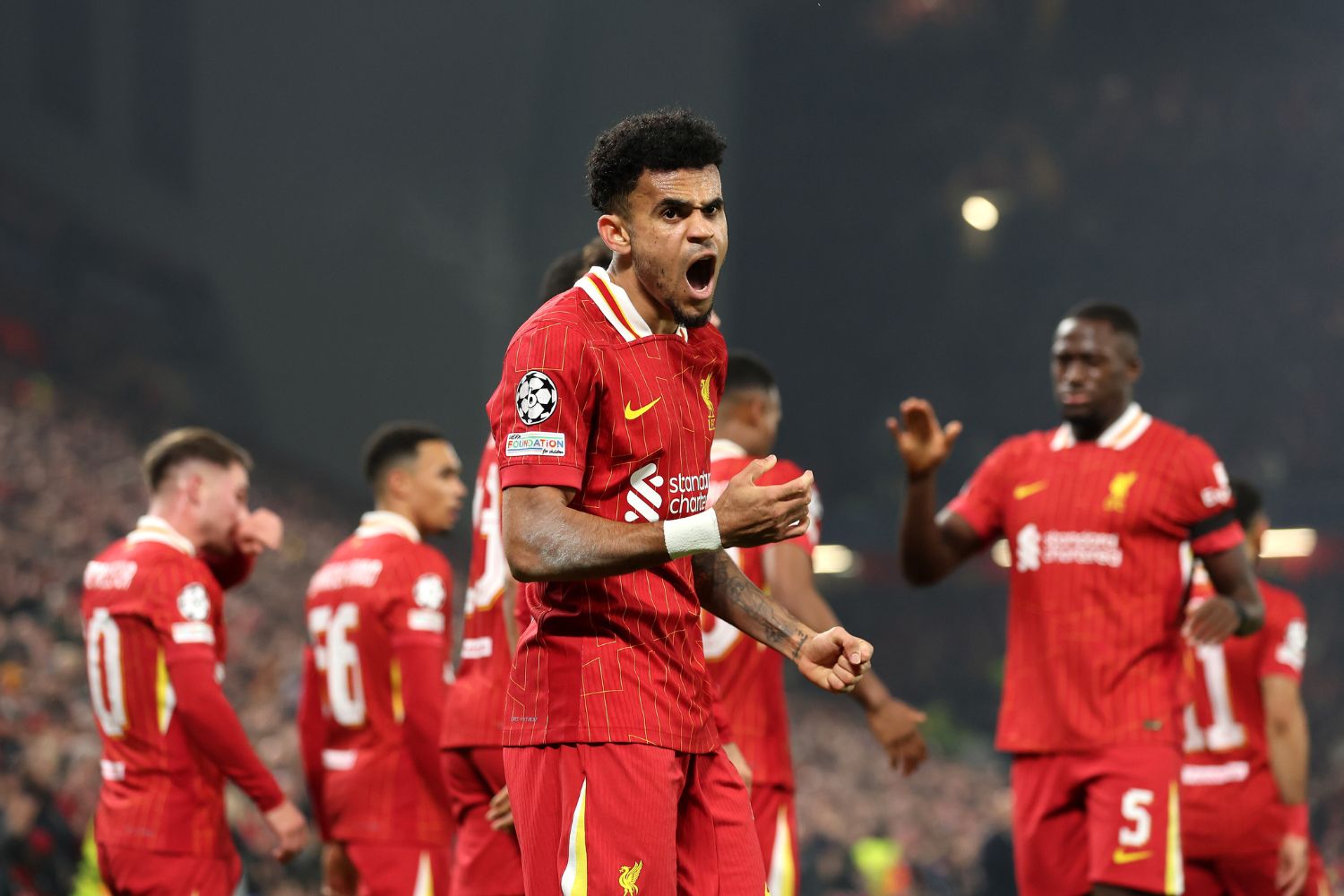 Luis Diaz celebrates in front of the Kop