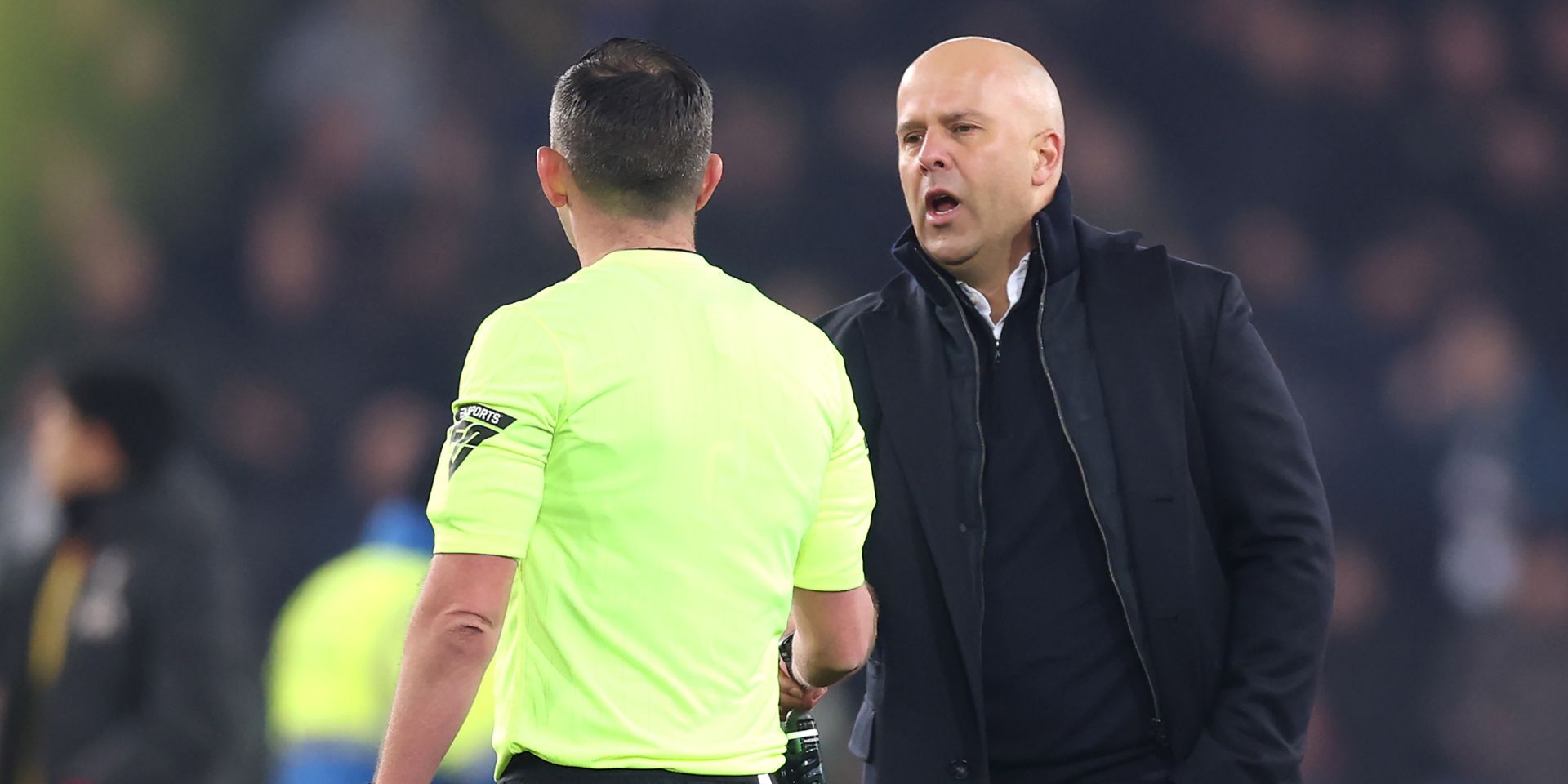 Arne Slot with Michael Oliver after full-time at Goodison Park
