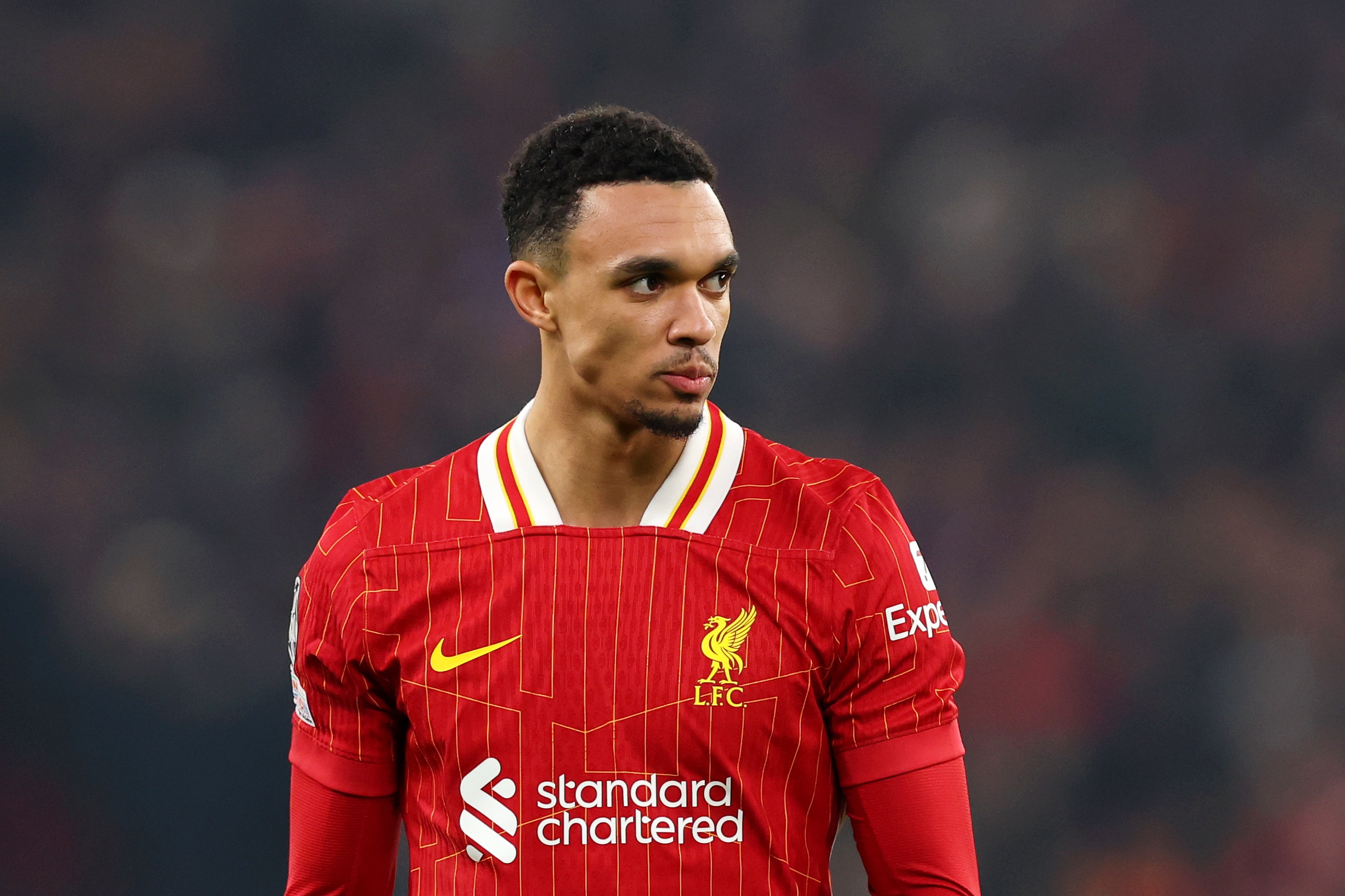 Trent Alexander-Arnold looks on into the distance.