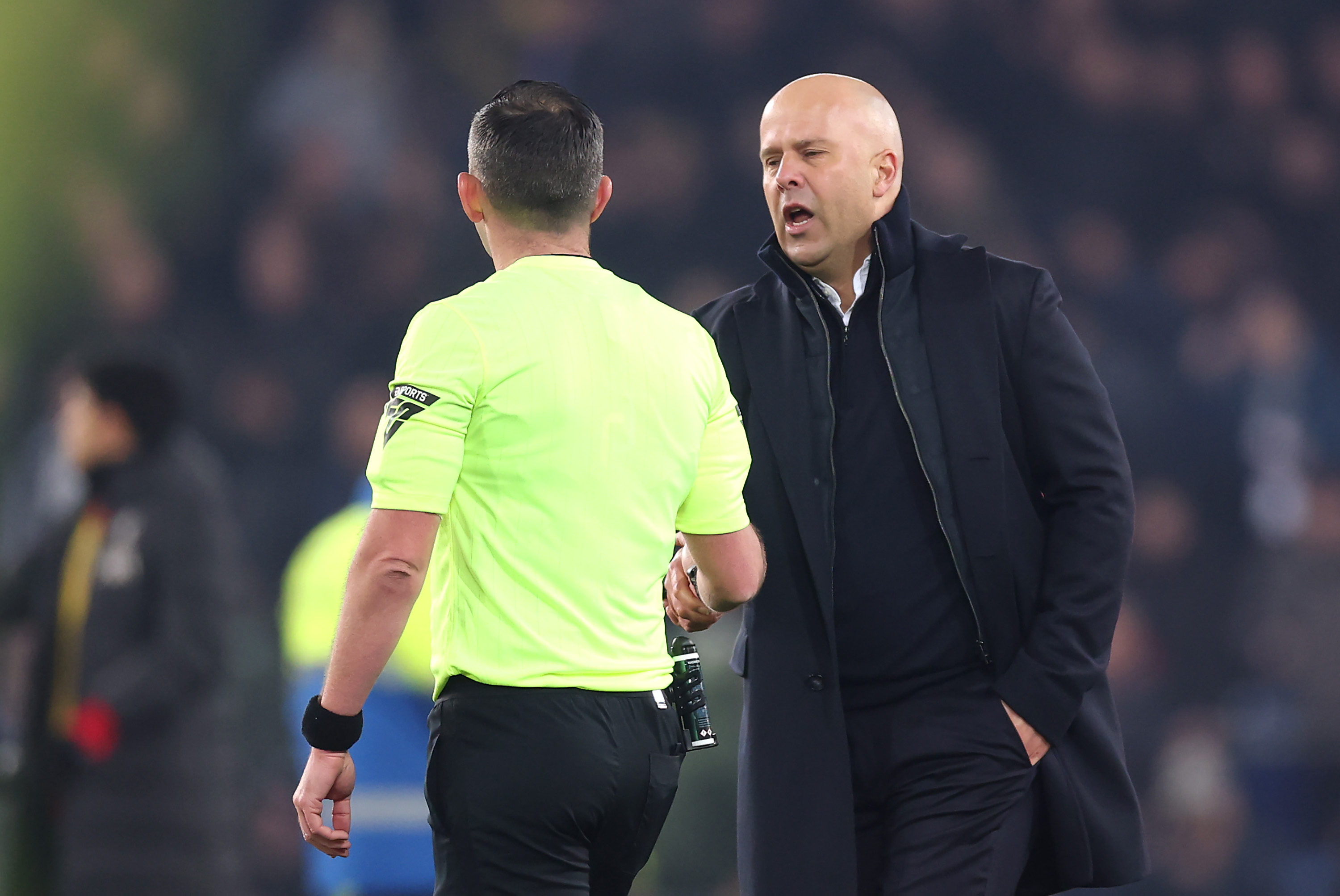 Arne Slot remonstrates with Michael Oliver after the Merseyside derby