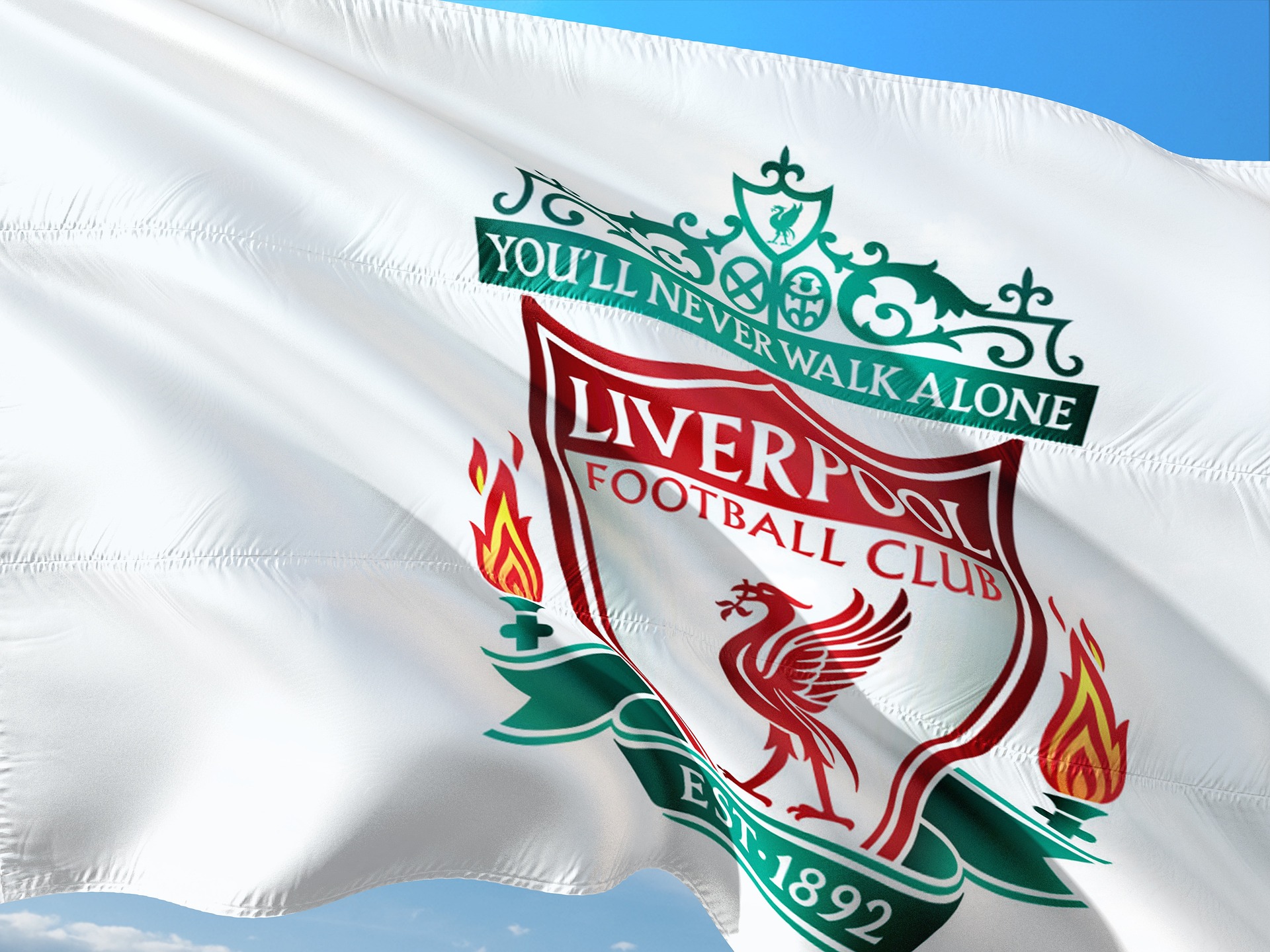 A white Liverpool flag waves in the wind.