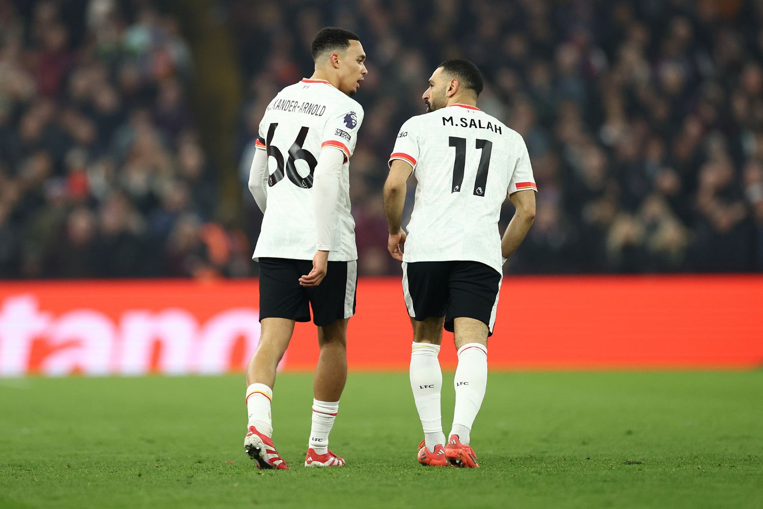 Trent Alexander-Arnold and Mo Salah playing for Liverpool