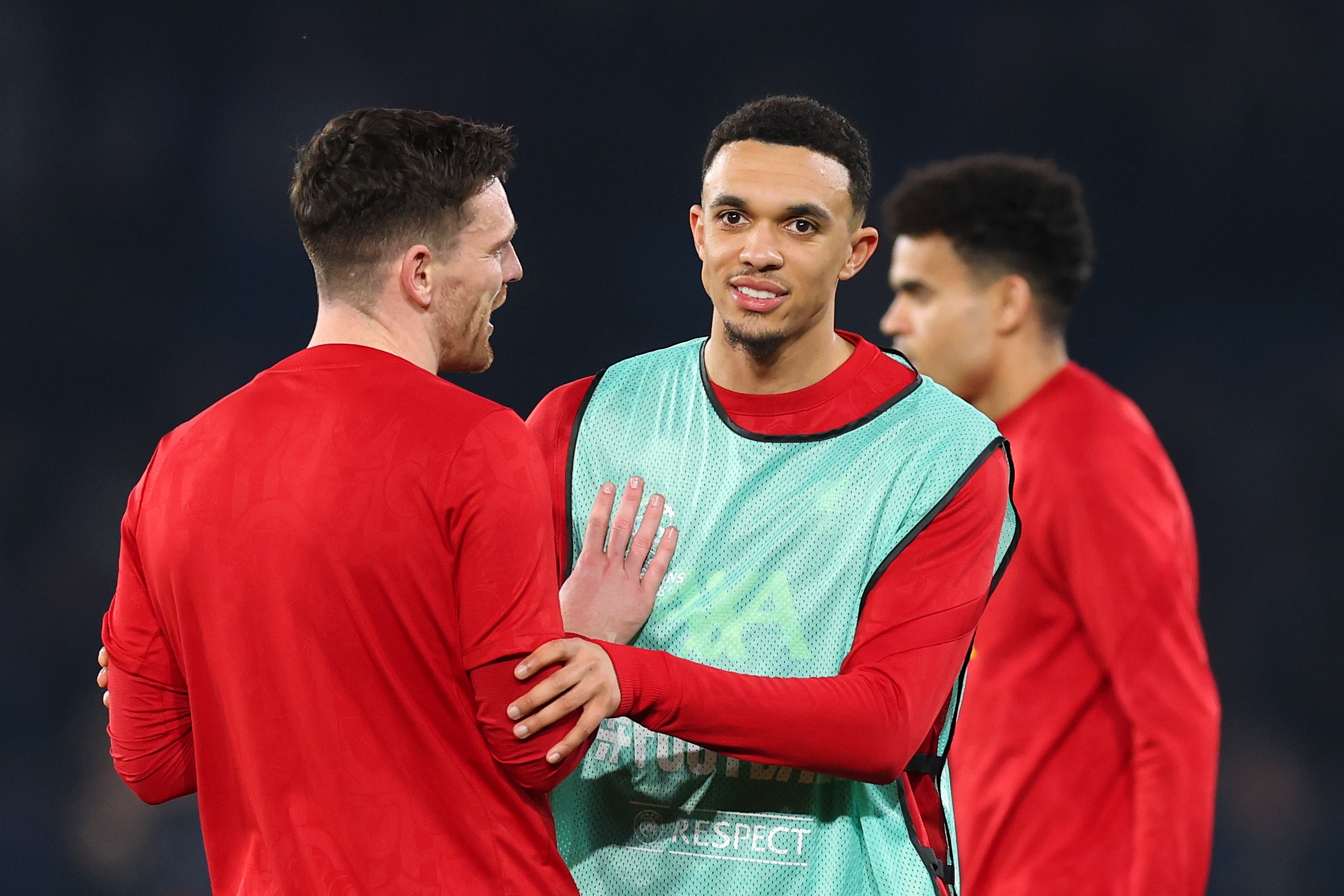 Trent Alexander-Arnold grabs Andy Robertson's arm.