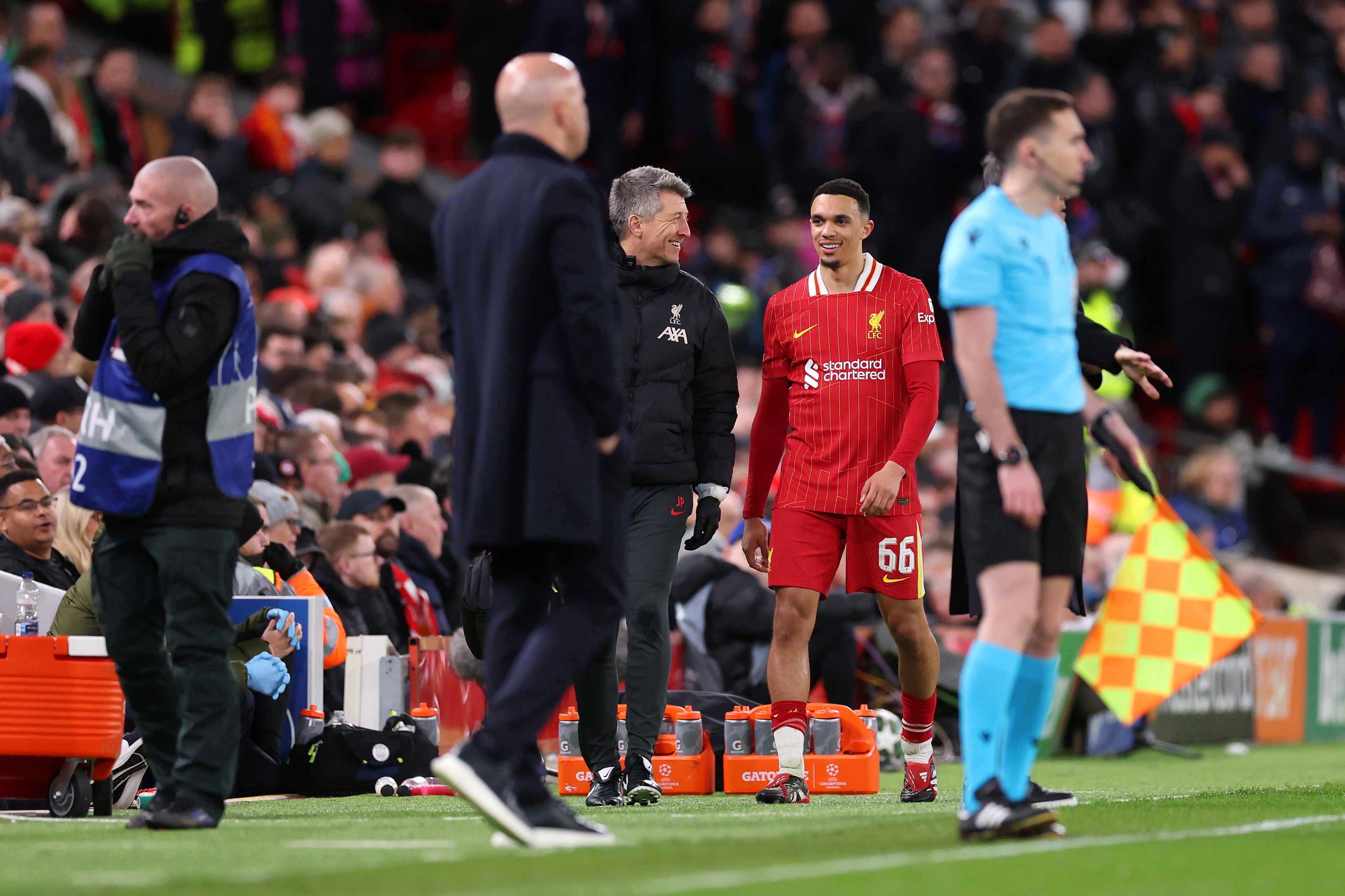 Trent Alexander-Arnold walks off talking to Liverpool physio.
