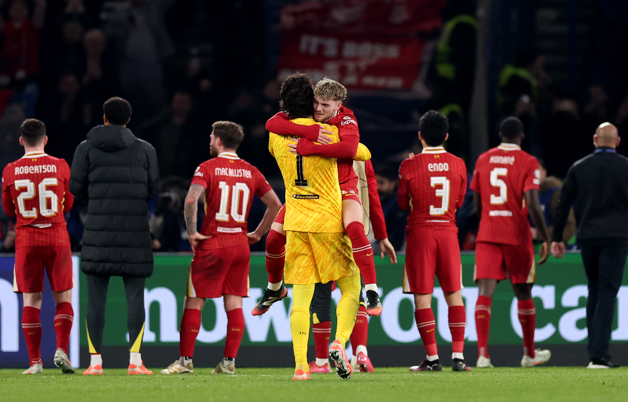 Harvey Elliot hugs Alisson Becker after Liverpool's 1-0 win over PSG