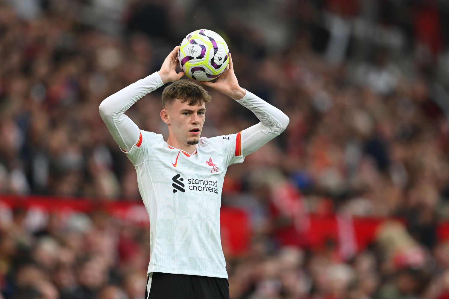 Conor Bradley takes a throw-in for Liverpool