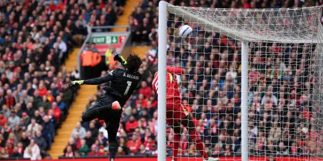 Alisson Becker saves against West Ham