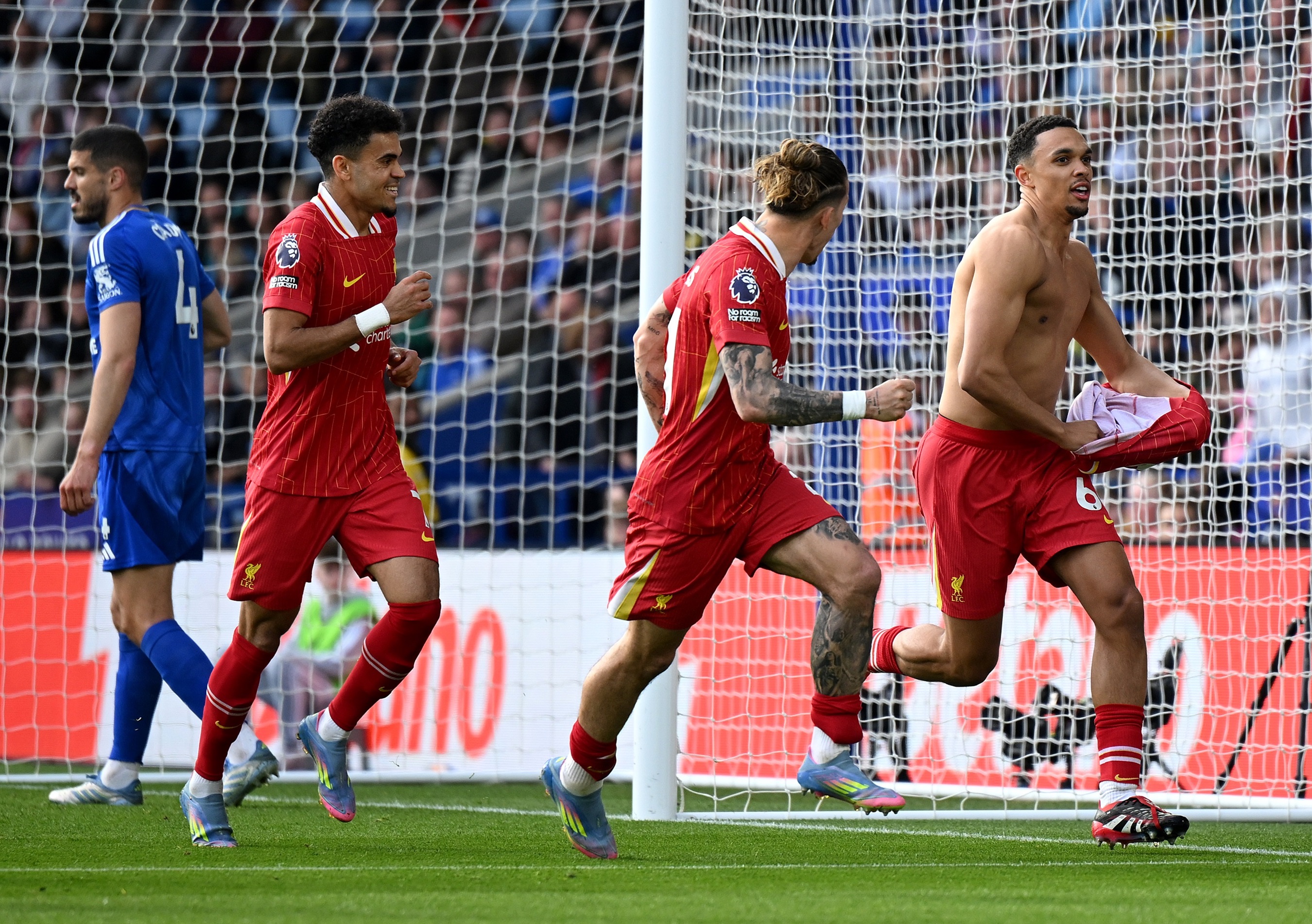 Trent Alexander-Arnold pulls off his shirt after scoring against Leicester.
