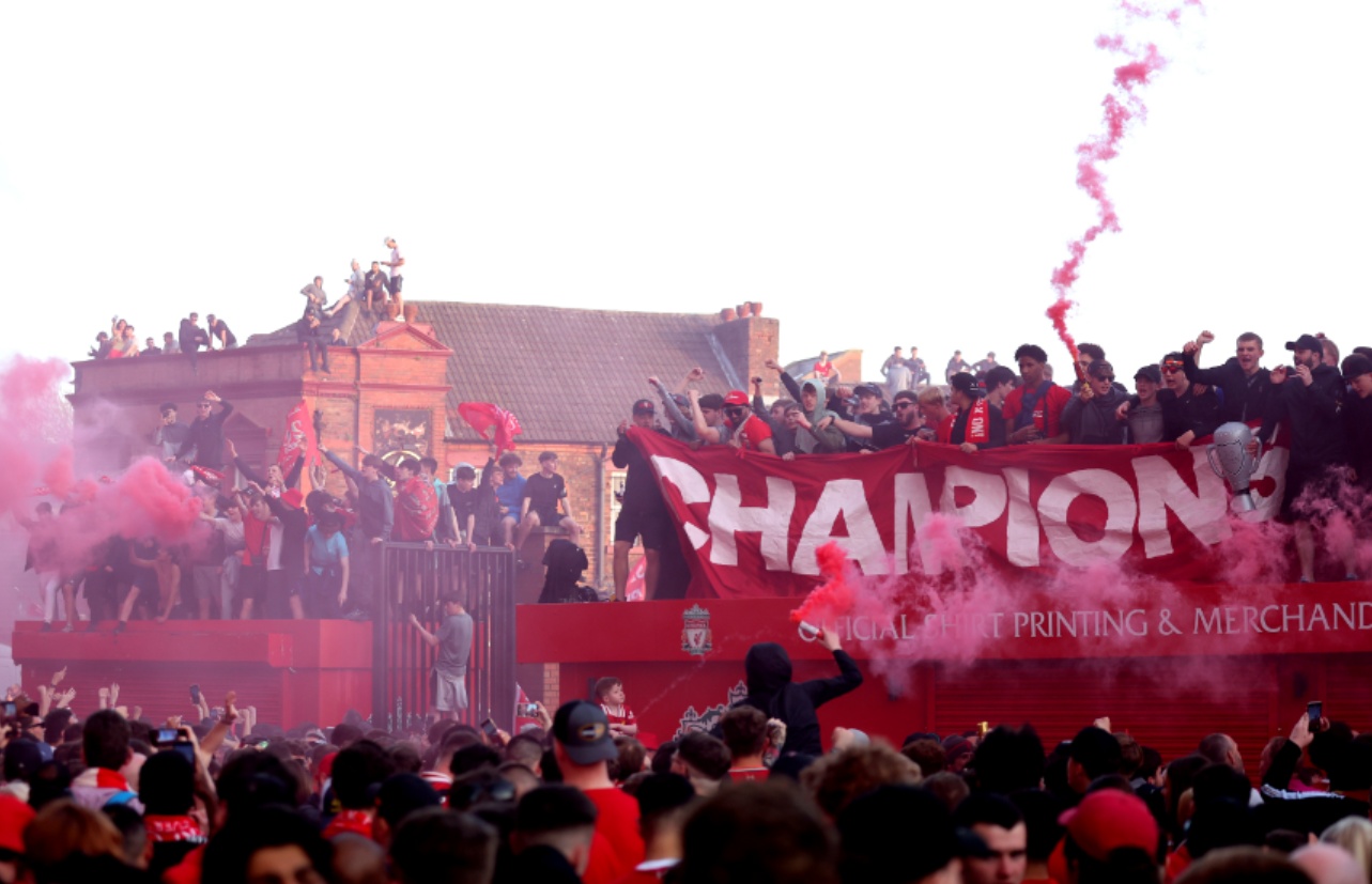 Liverpool fans celebrate after their team clinched the Premier League title on Sunday