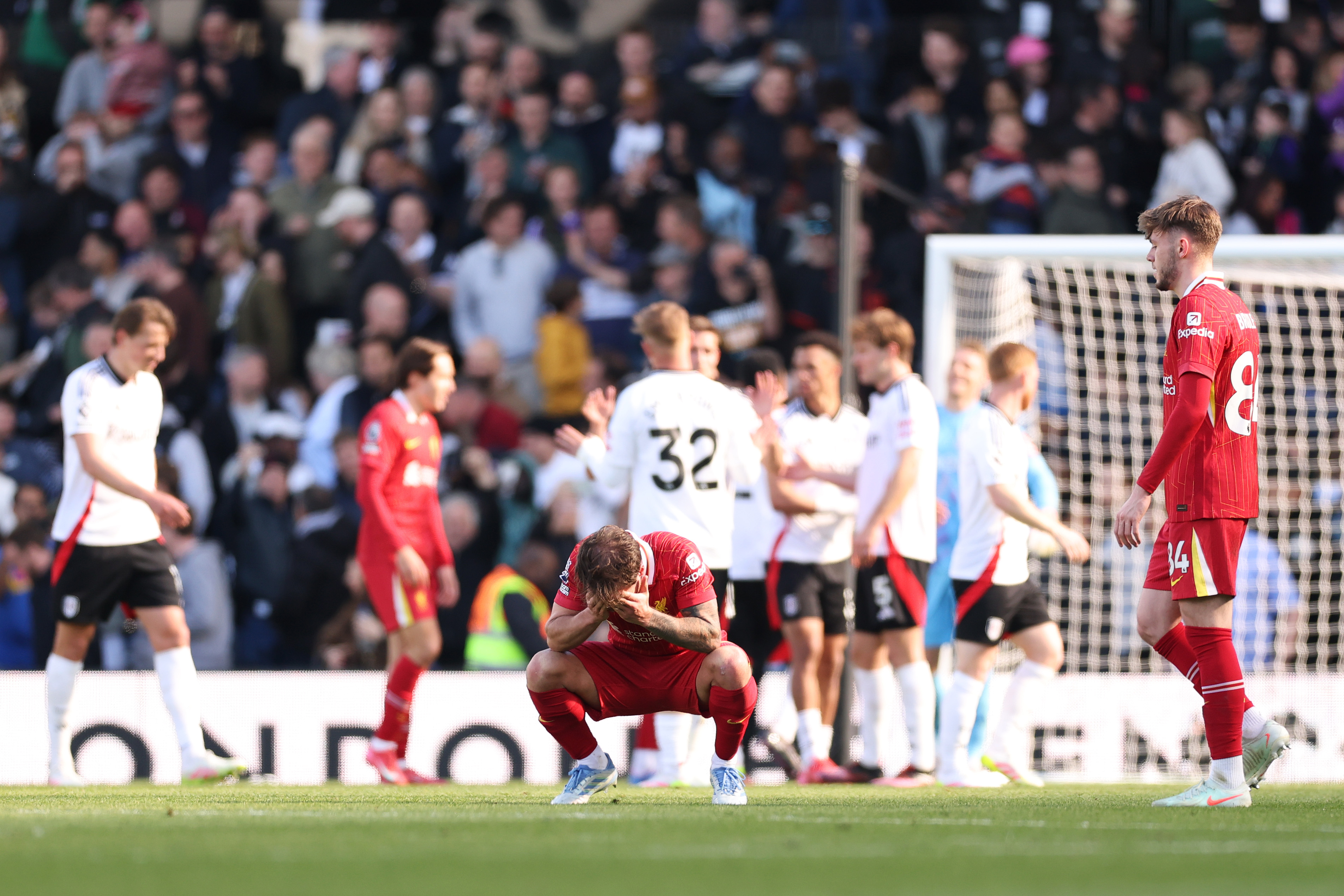 Alexis Mac Allister slumps to the ground after Liverpool's defeat at Fulham on Sunday