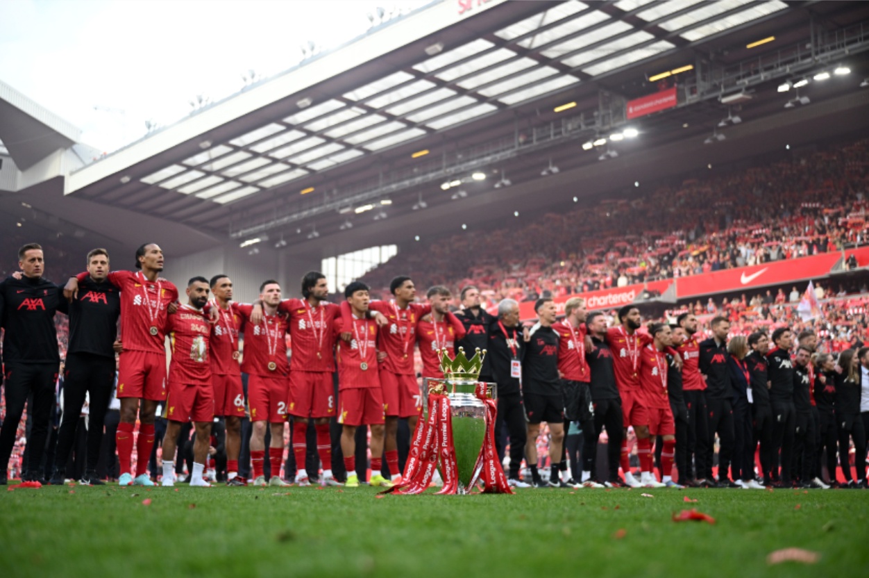 Liverpool players sing You'll Never Walk Alone to the Kop after receiving the Premier League trophy