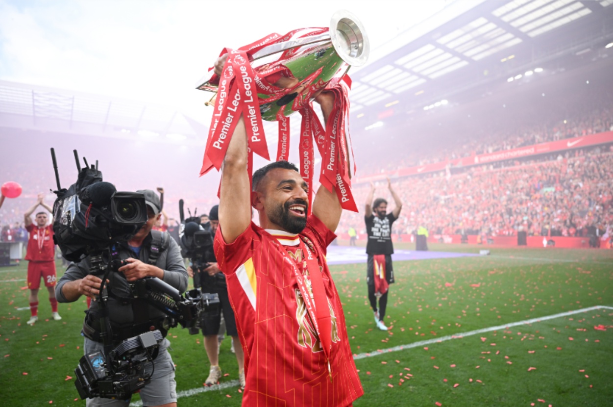 Mo Salah raises the Premier League trophy at Anfield
