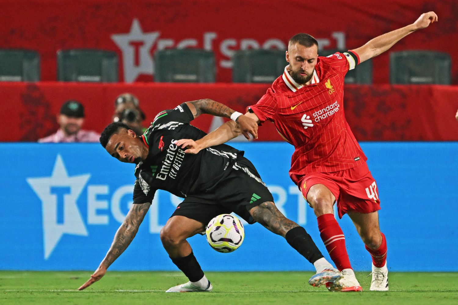 Nat Phillips battles with Gabriel Jesus for the ball