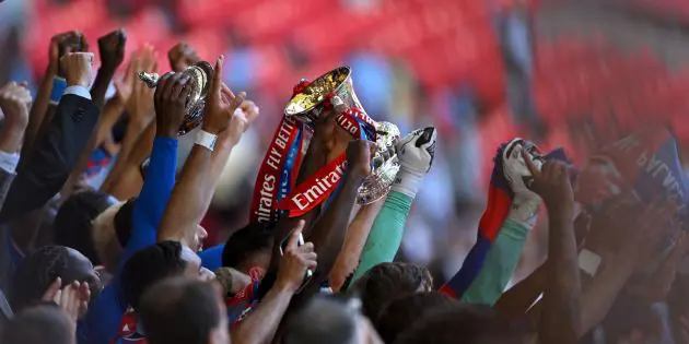 Marc Guehi lifts the FA Cup at Wembley