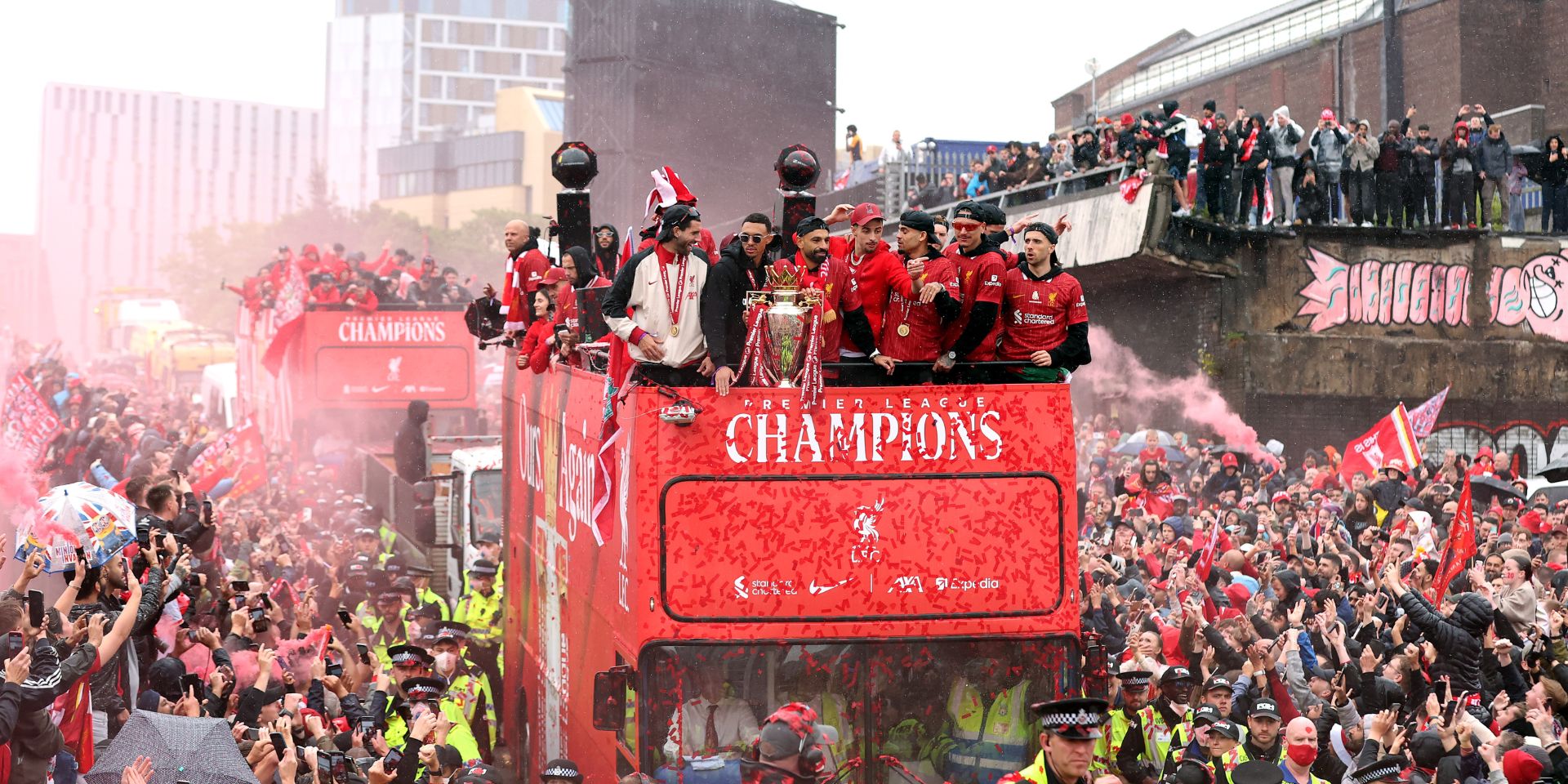 Liverpool players celebrate in the trophy parade