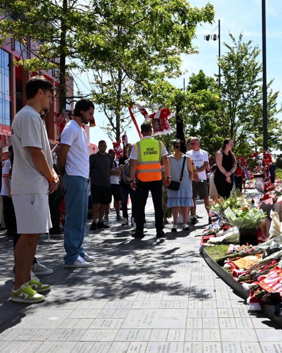 Milos Kerkez and Dominik Szoboszlai pay their respects to Diogo Jota outside Anfield