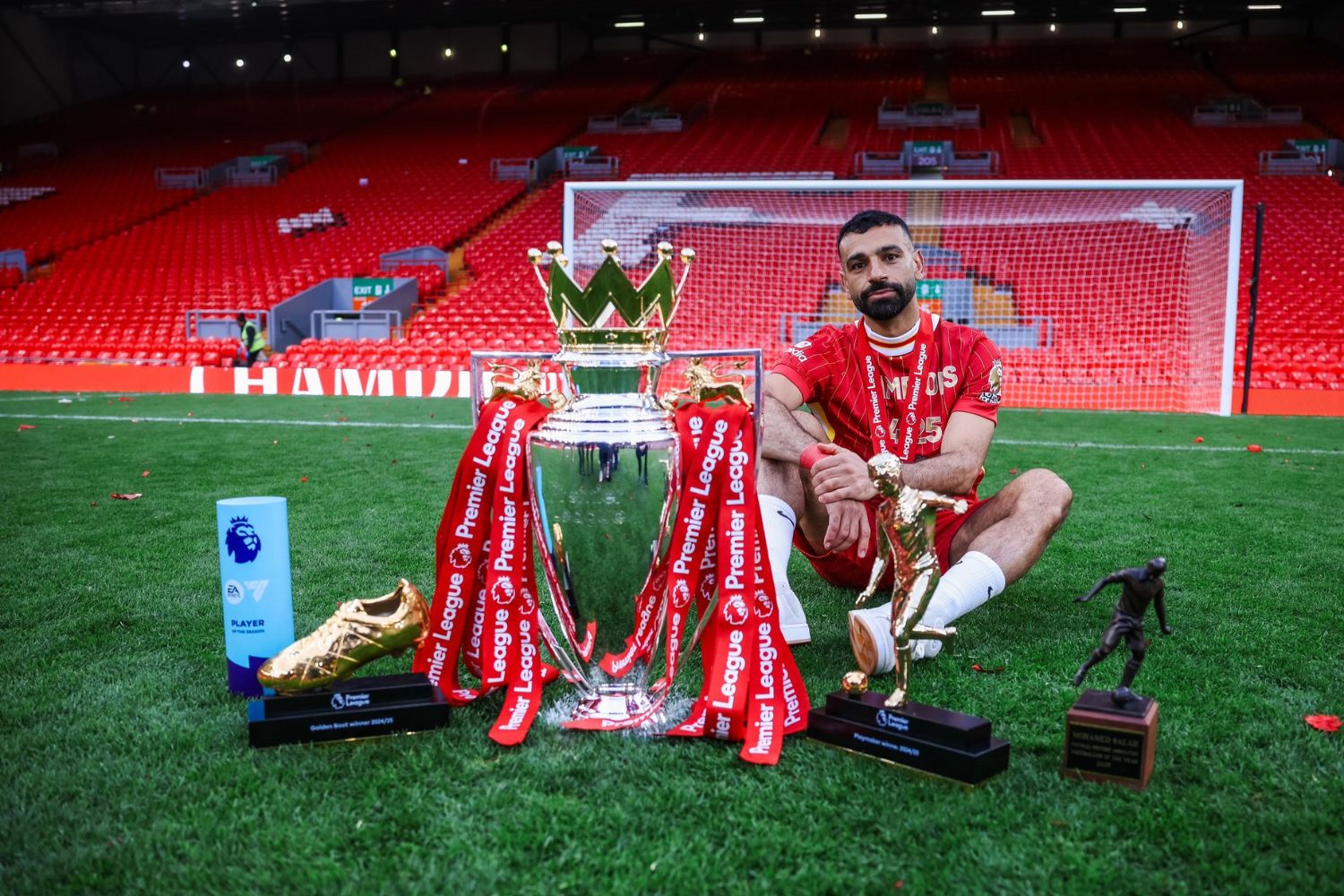 Mo Salah sits with his and Liverpool's awards