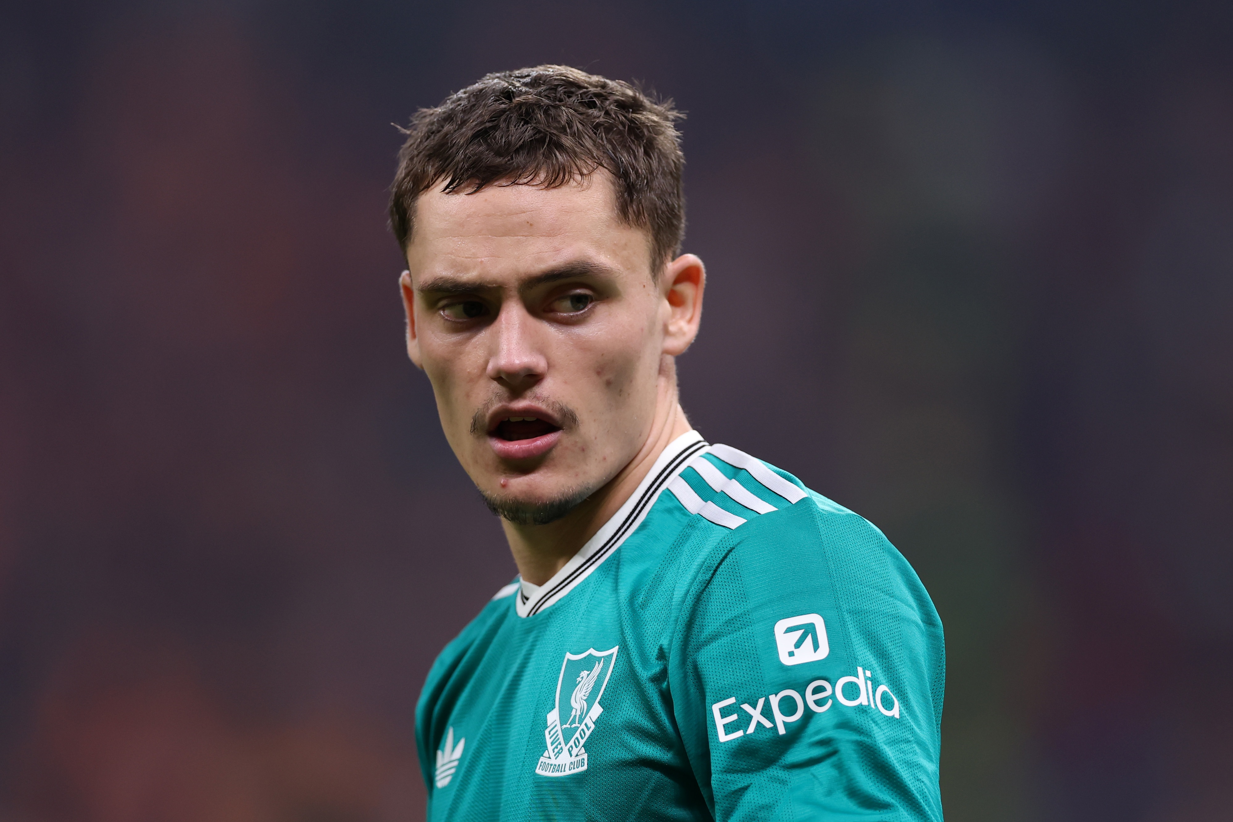 Florian Wirtz looks over his shoulder in the green Liverpool kit.