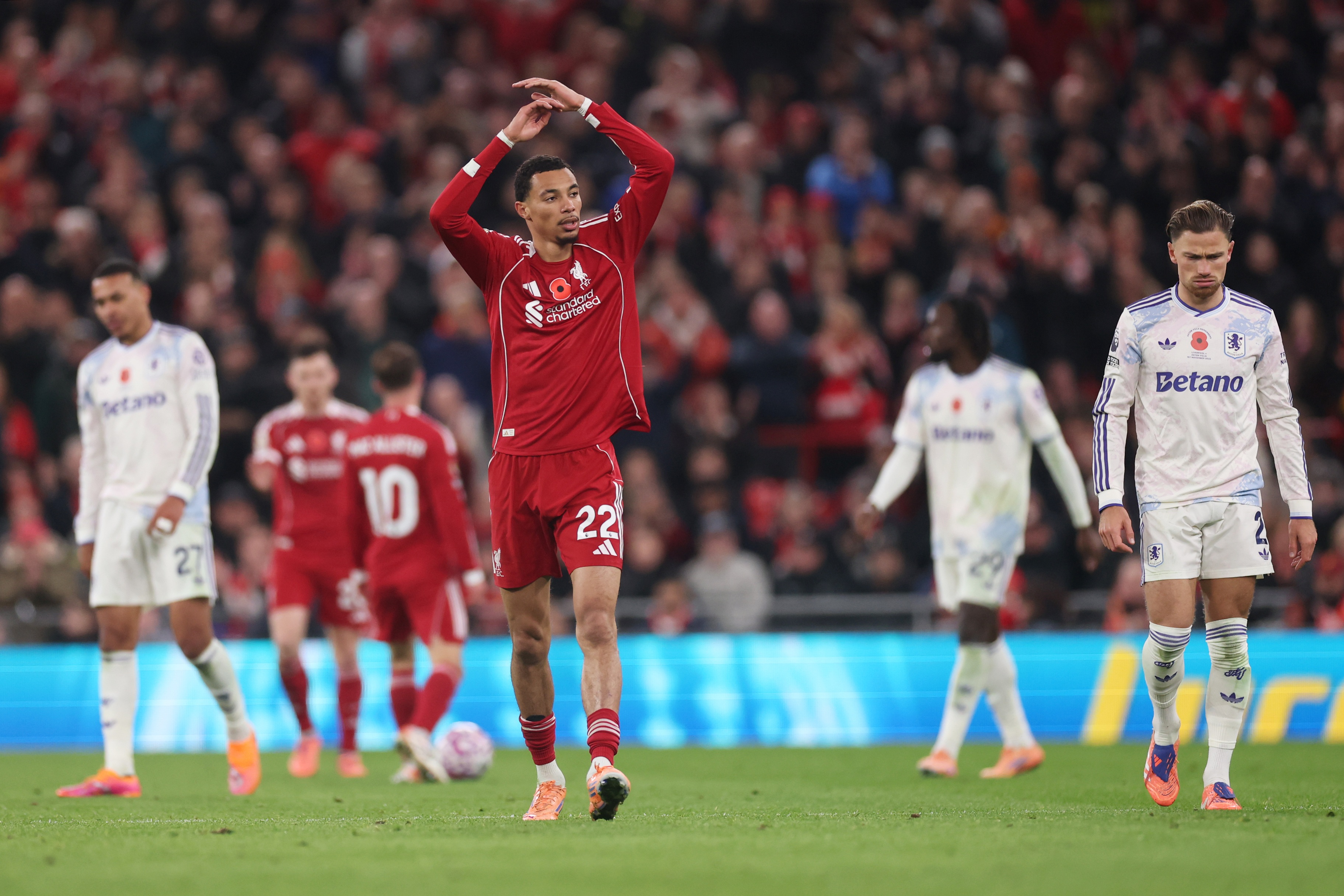 Hugo Ekitike throws up his arms at Anfield.
