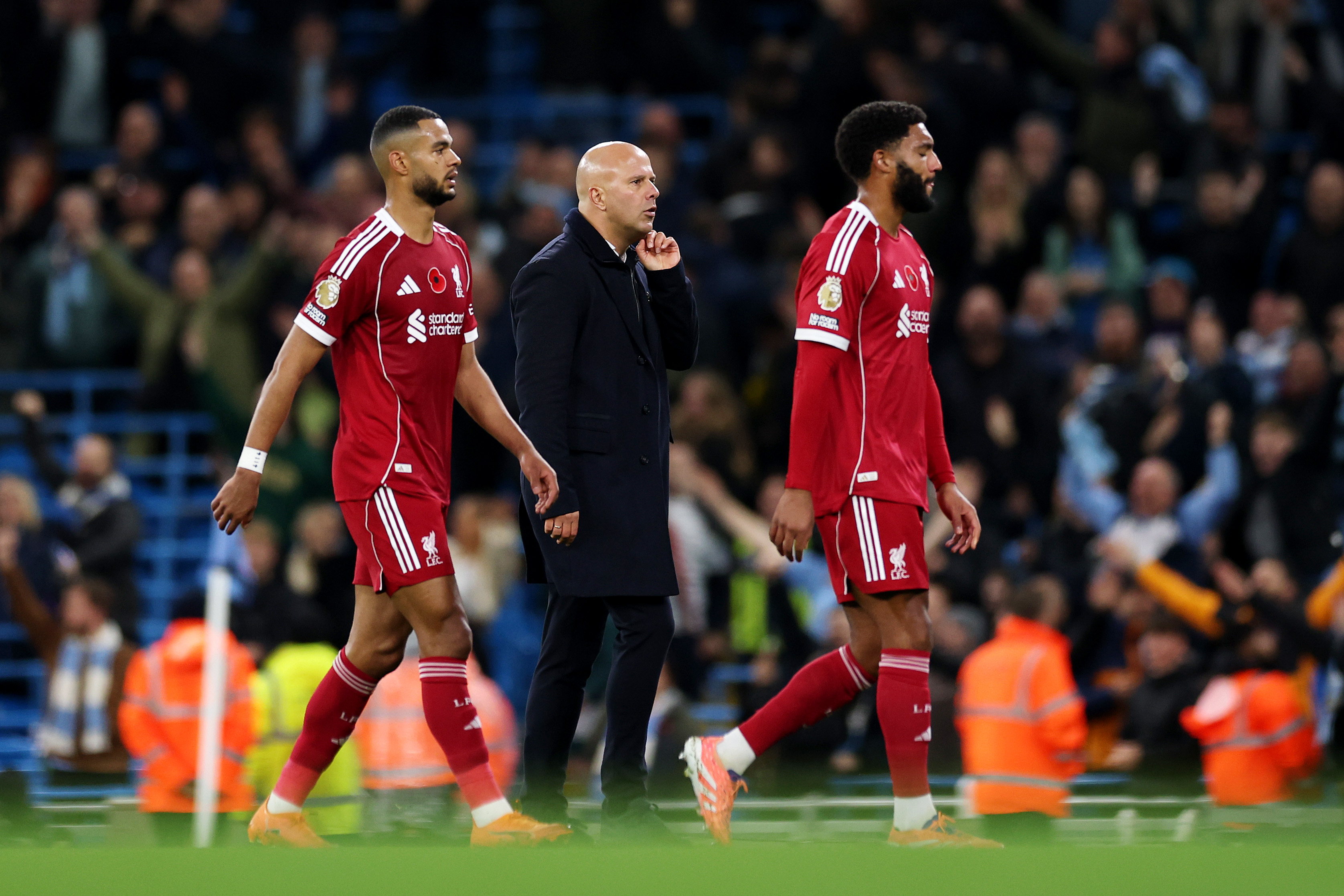 Joe Gomez, Cody Gakpo and Arne Slot after defeat by Man City
