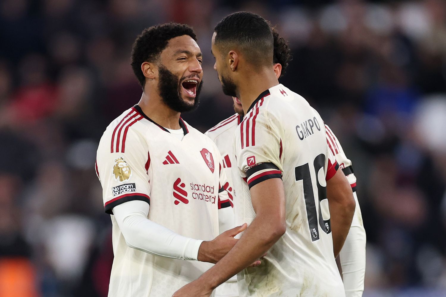 Cody Gakpo and Joe Gomez celebrate after scoring against West Ham