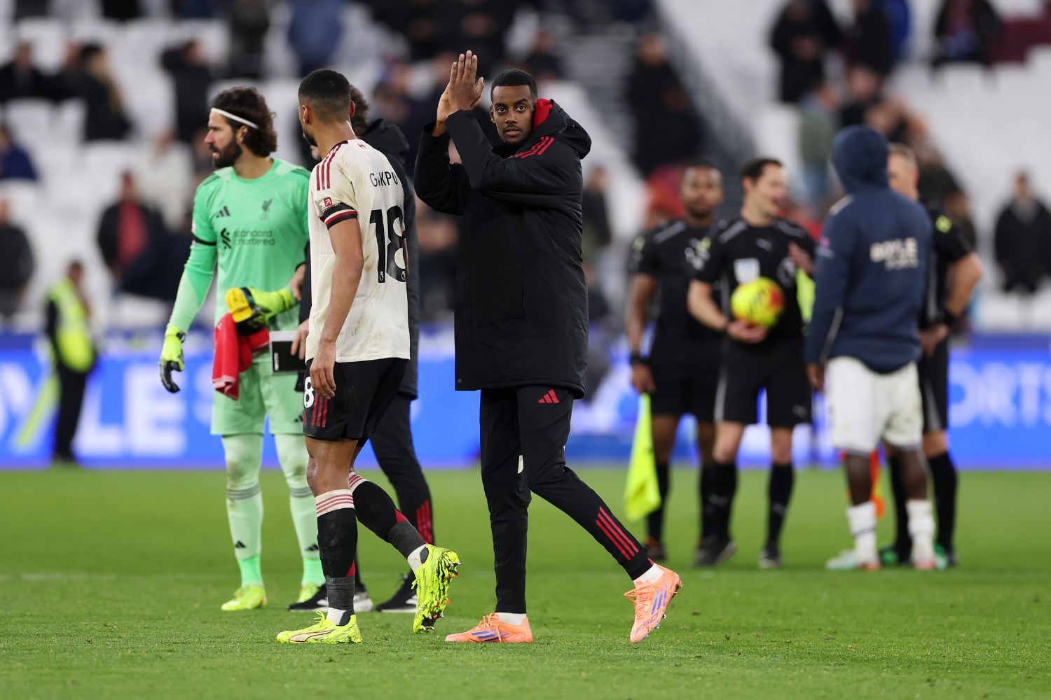 Alexander Isak applauds Liverpool fans at West Ham