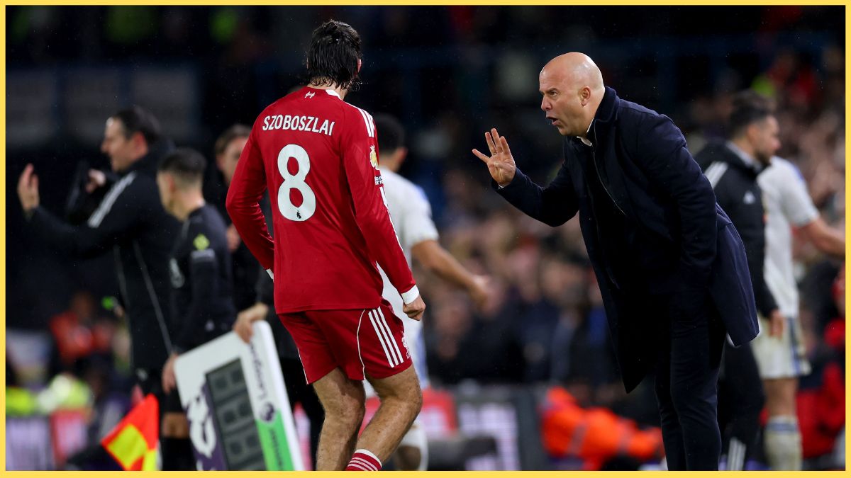 Dominik Szoboszlai receives instructions from Arne Slot