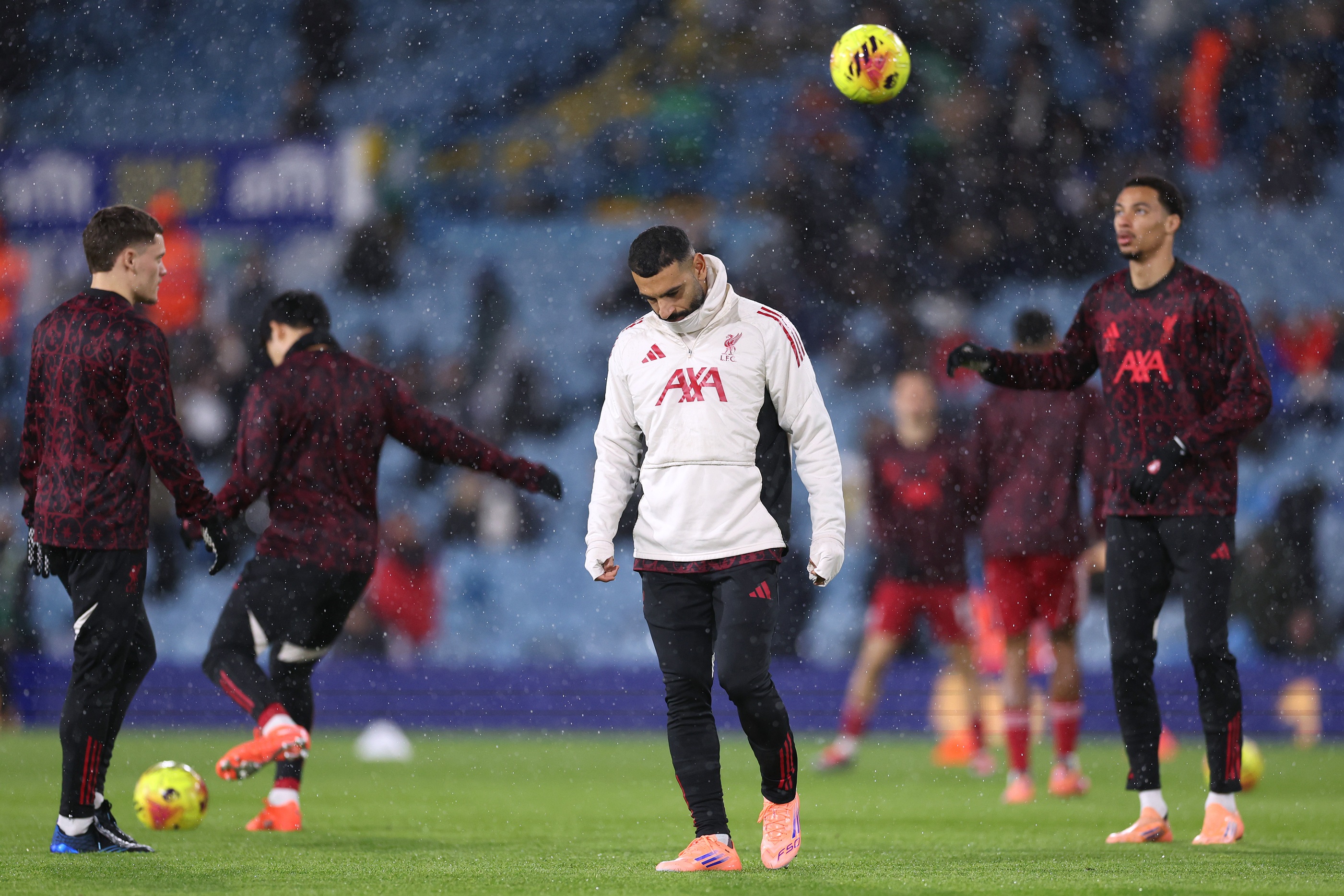 Mo Salah looks down at the pitch.