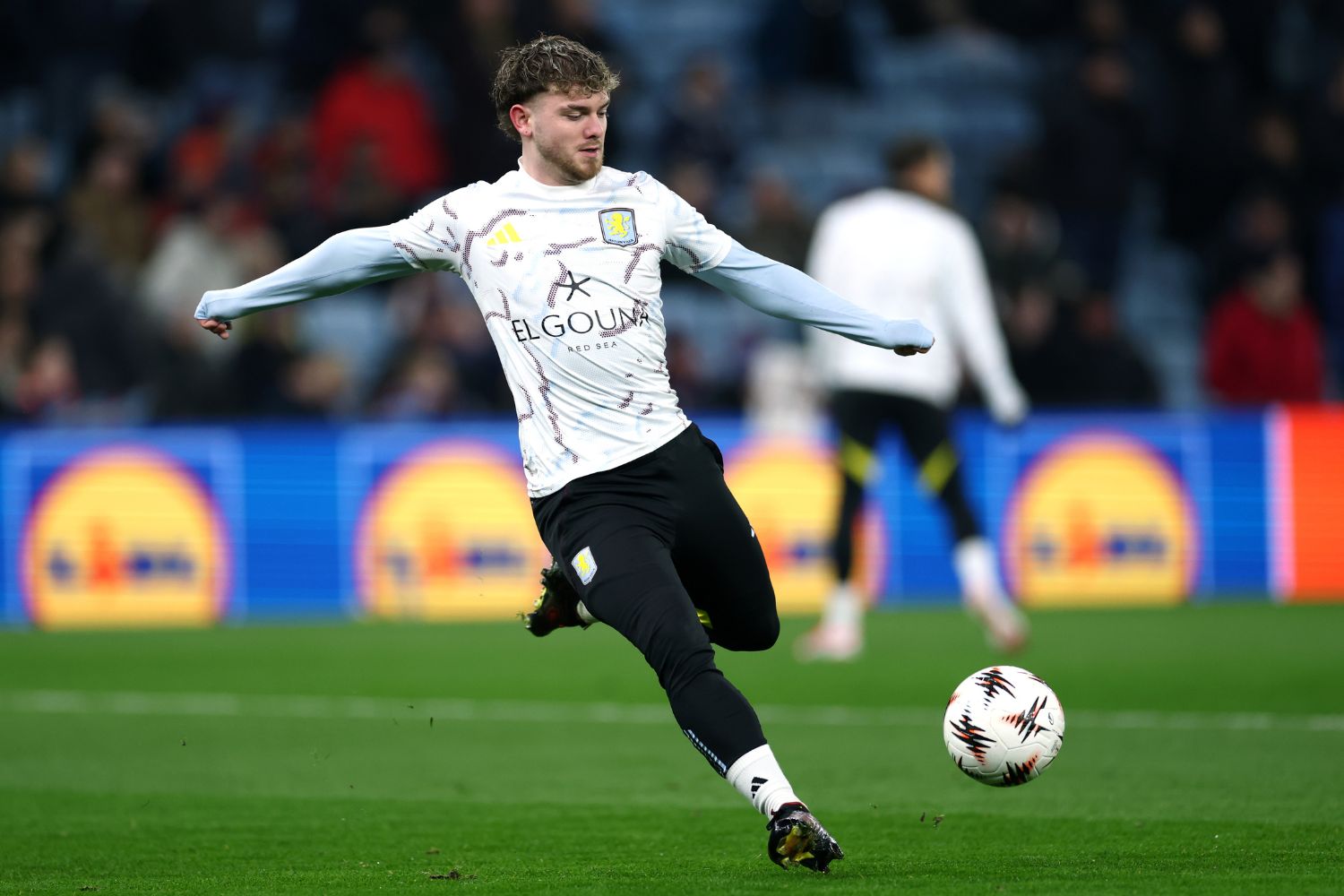 Harvey Elliott warms up for Aston Villa