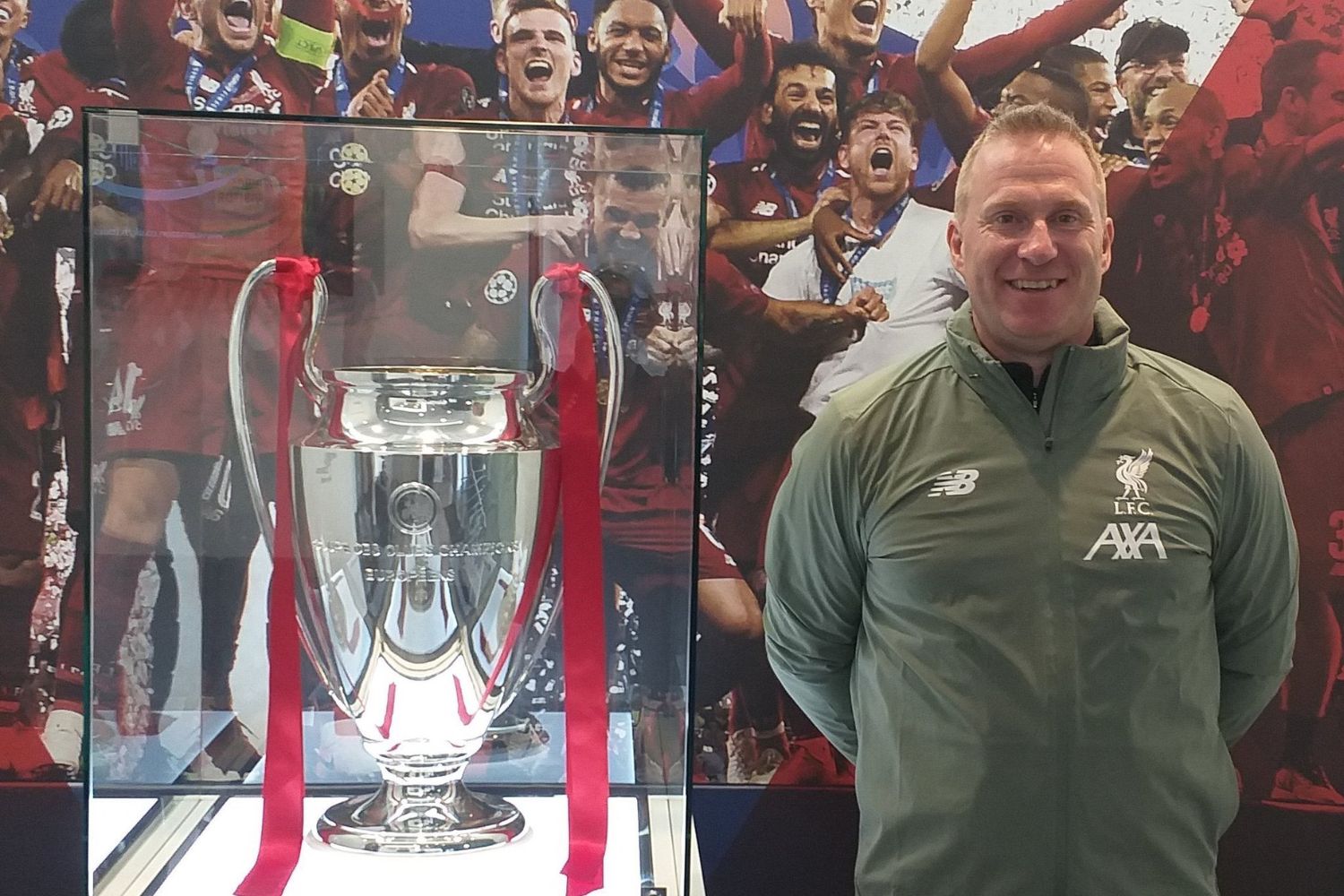 Thomas Gronnemark posing with Liverpool's Champions League trophy in 2019
