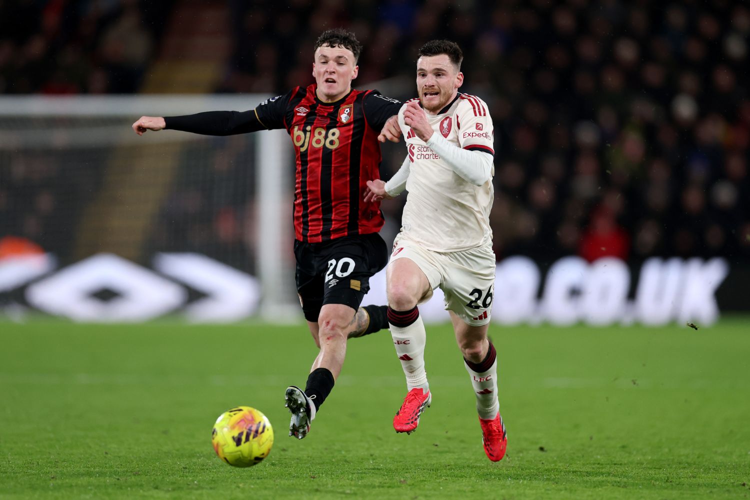 Andrew Robertson of Liverpool is challenged by Alex Jimenez of AFC Bournemouth
