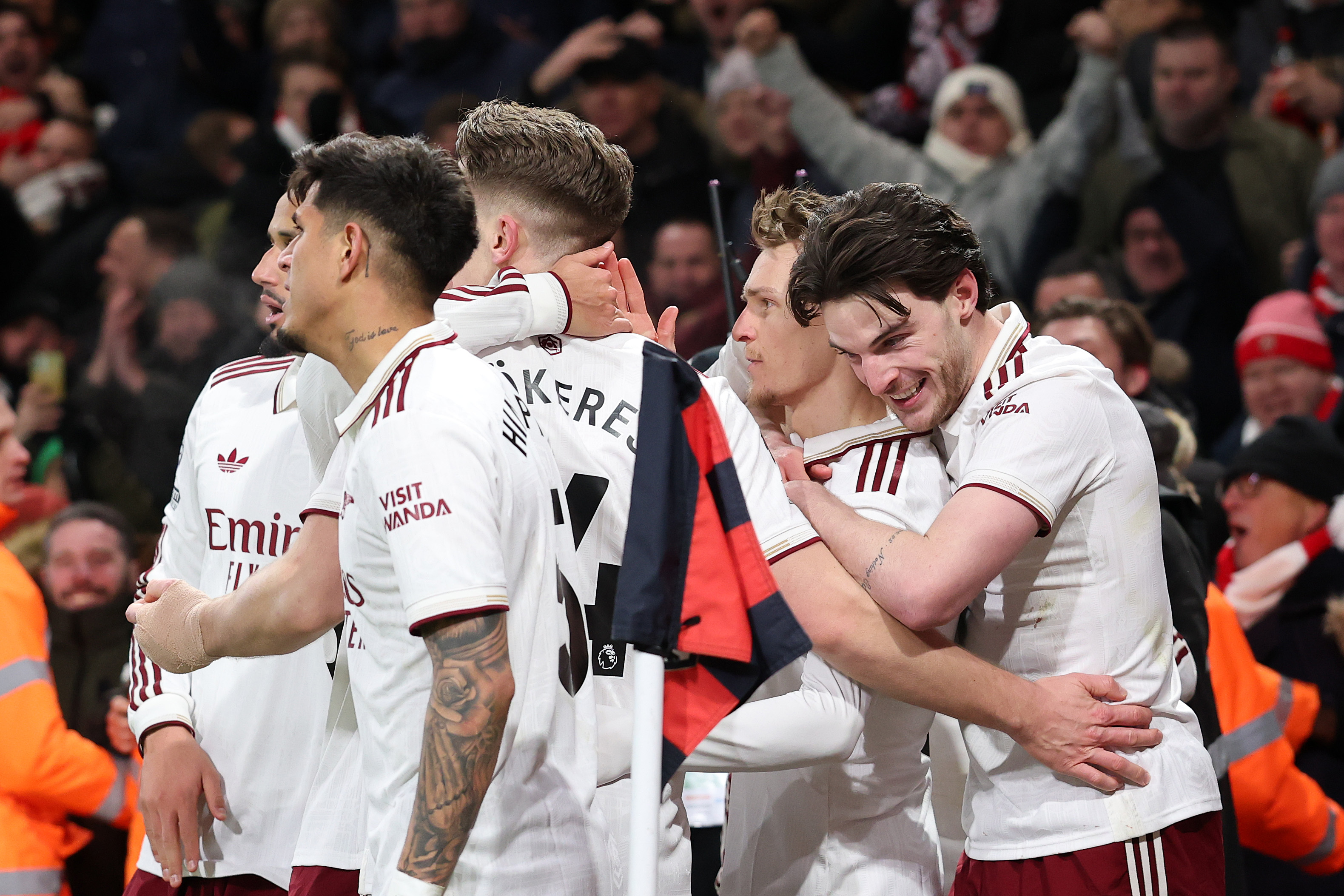 Arsenal players celebrate one of their three goals against Bournemouth last Saturday