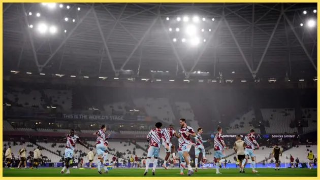 Michael Kayode warms up with his Brentford teammates