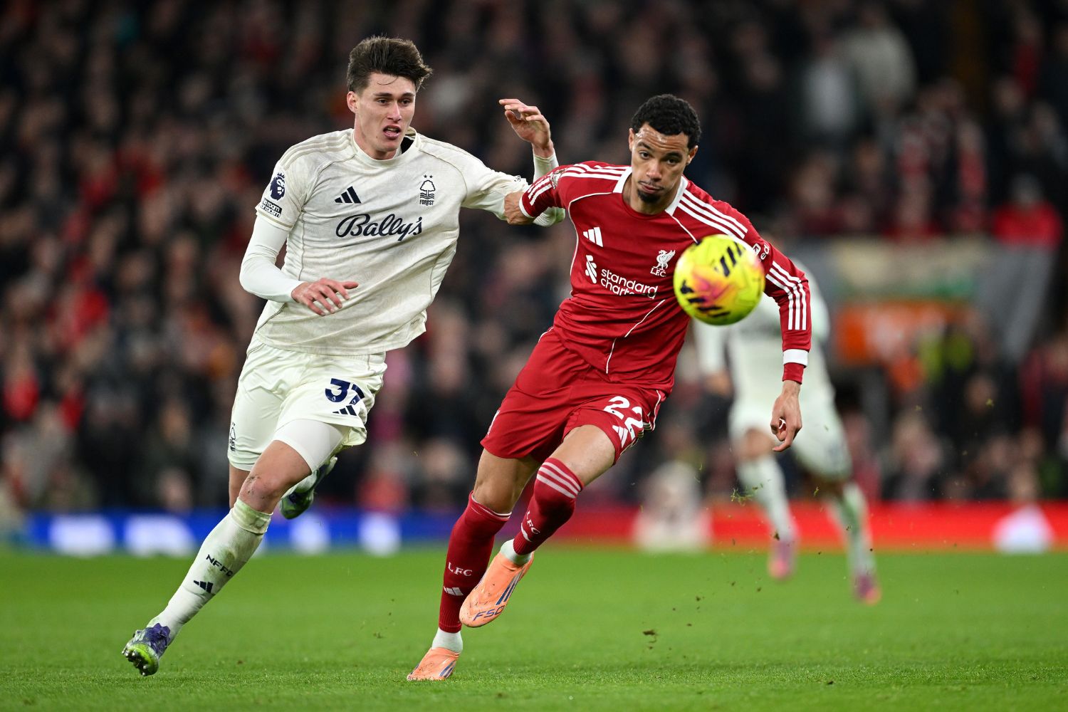 Hugo Ekitike of Liverpool is challenged by Nicolo Savona of Nottingham Forest