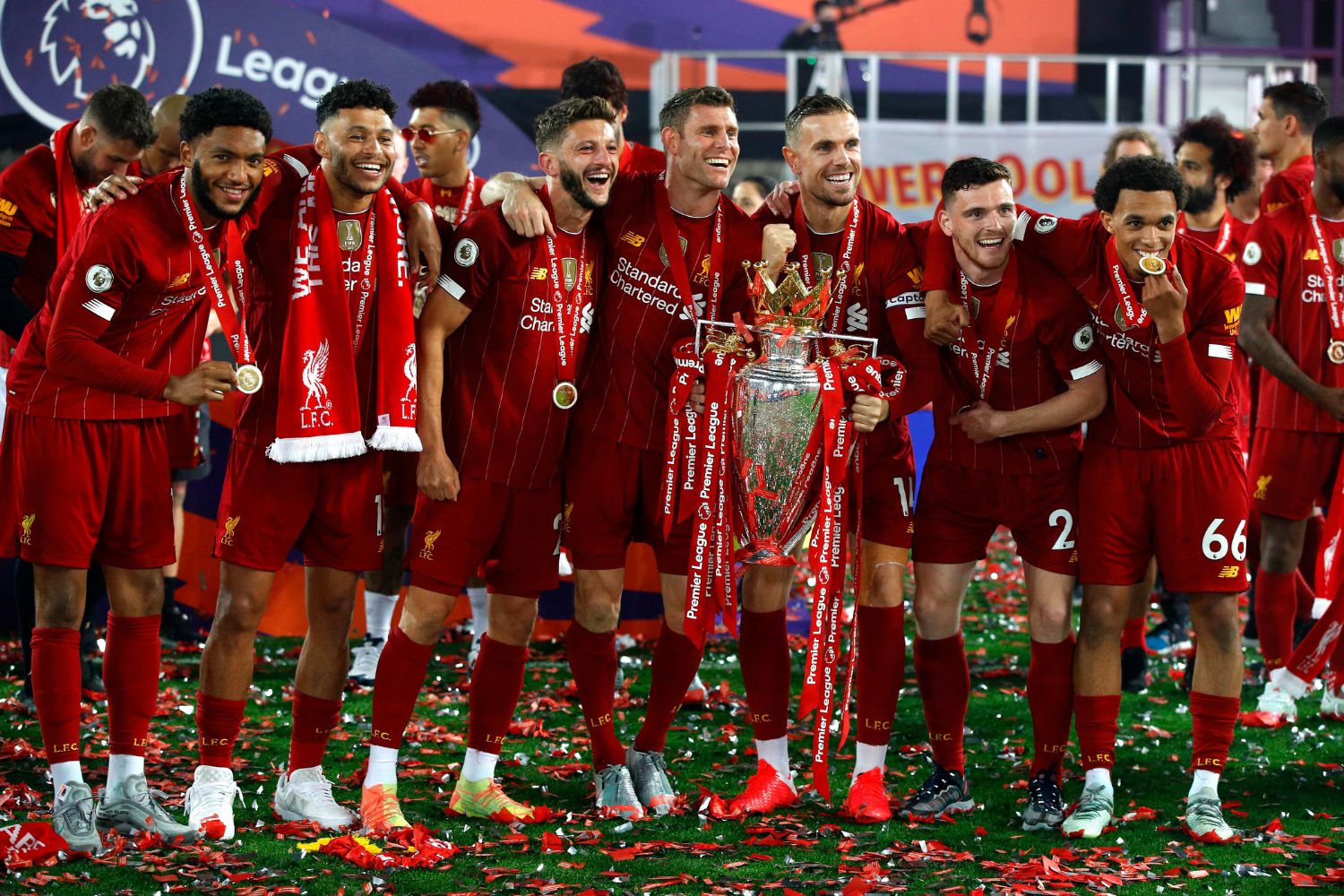 Joe Gomez, Alex Oxlade-Chamberlain, Adam Lallana, James Milner, Jordan Henderson, Andy Robertson and Trent Alexander-Arnold of Liverpool celebrate with The Premier League trophy