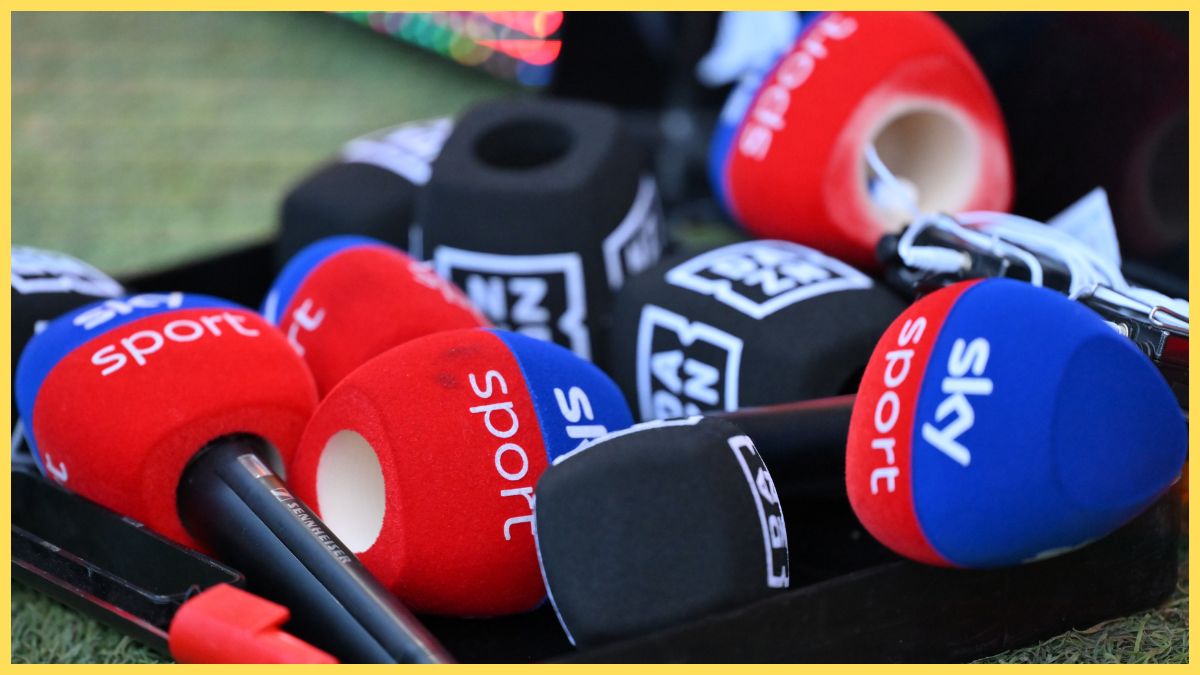 Several microphone covers from Sky Sports and DAZN lie next to each other.
