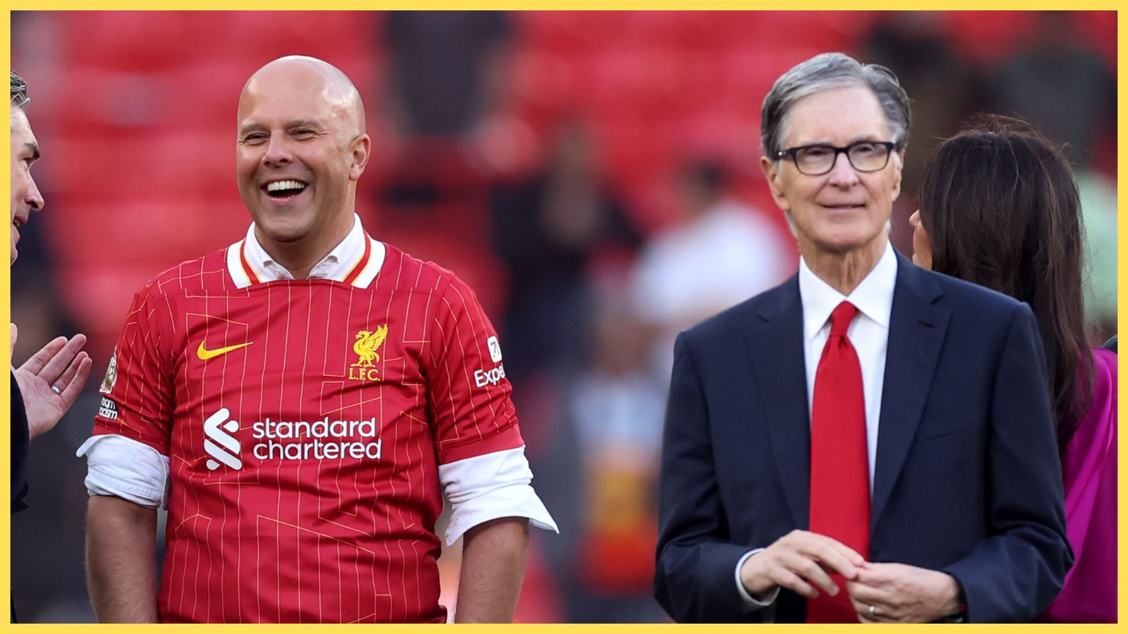 Arne Slot stands next to principal Liverpool owner John W Henry.
