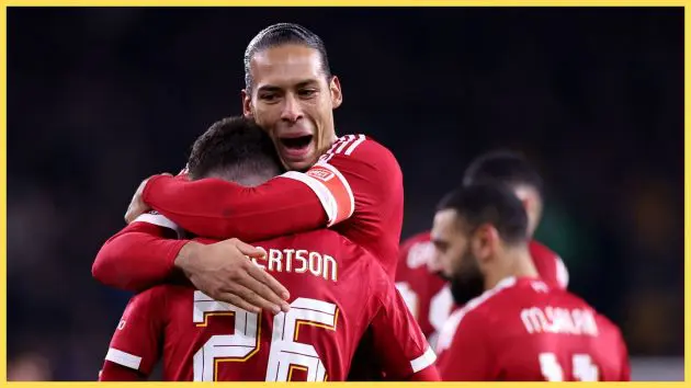 Virgil van Dijk wraps his arms around Andy Robertson.