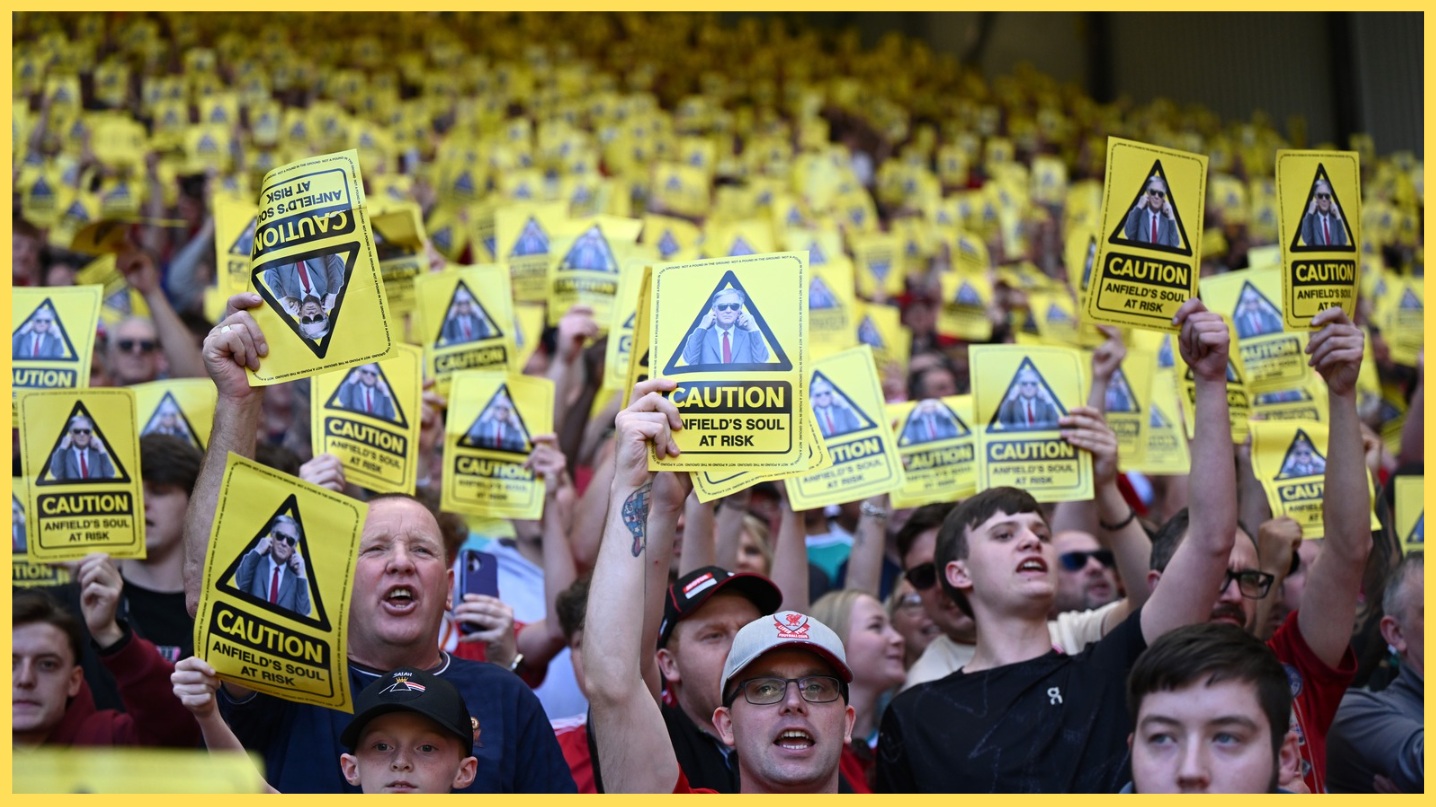 Liverpool fans hold up yellow cards in protest at FSG during the home game against Palace