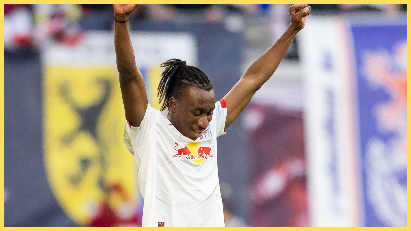 Yan Diomande pumps his arms in the air in celebration during RB Leipzig game.