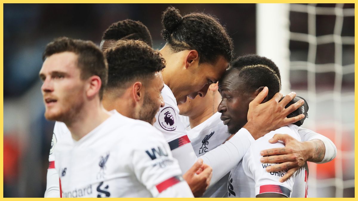 Sadio Mane of Liverpool celebrates with teammate Virgil van Dijk after scoring his team's second goal during the Premier League match between Aston Villa and Liverpool FC at Villa Park