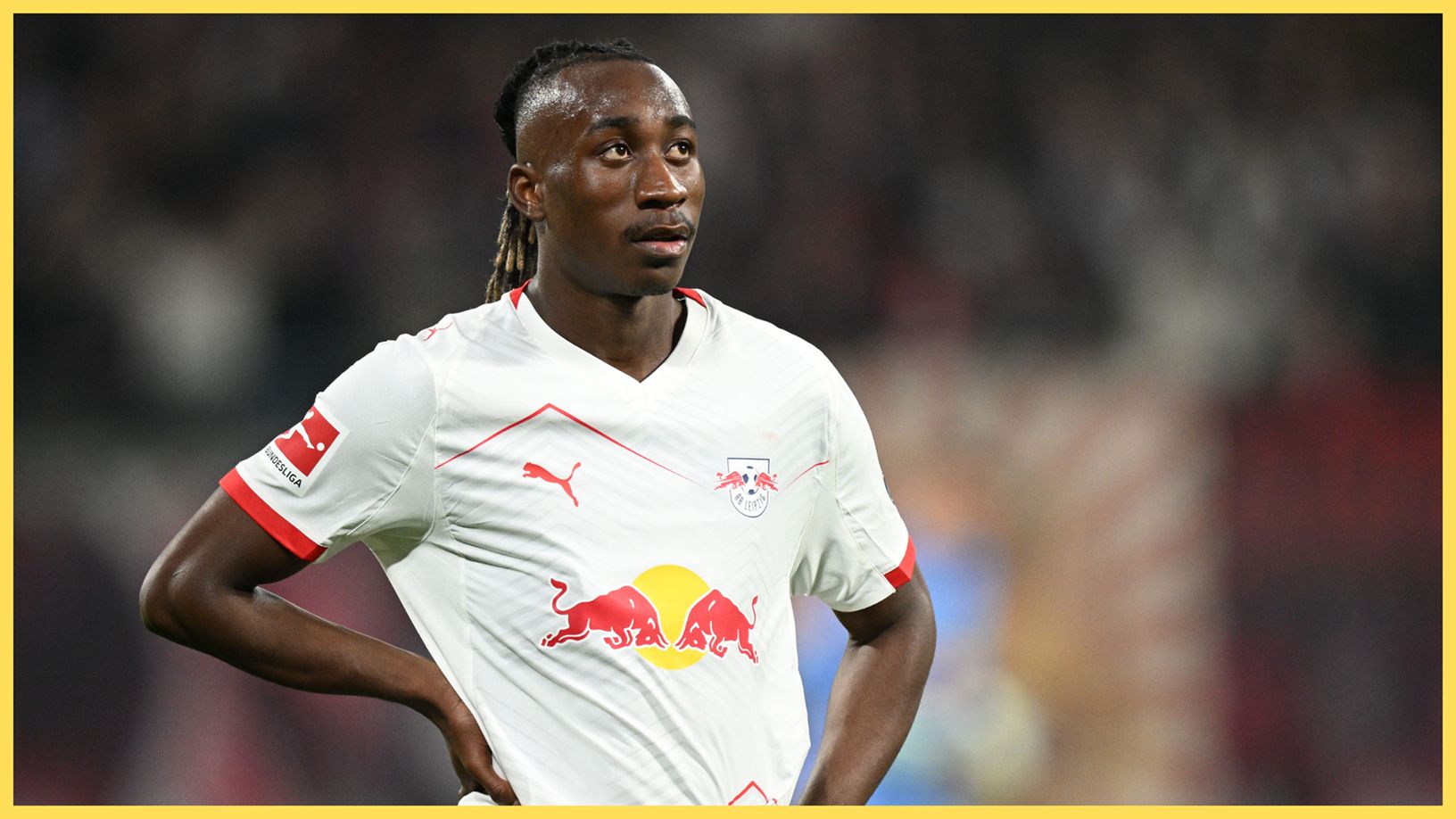 Liverpool-linked Yan Diomande puts his hands on his hips during RB Leipzig game.