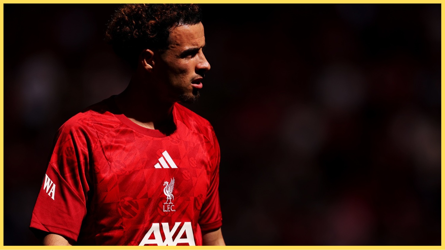 Curtis Jones pictured during the warm-up for a Liverpool game at Anfield